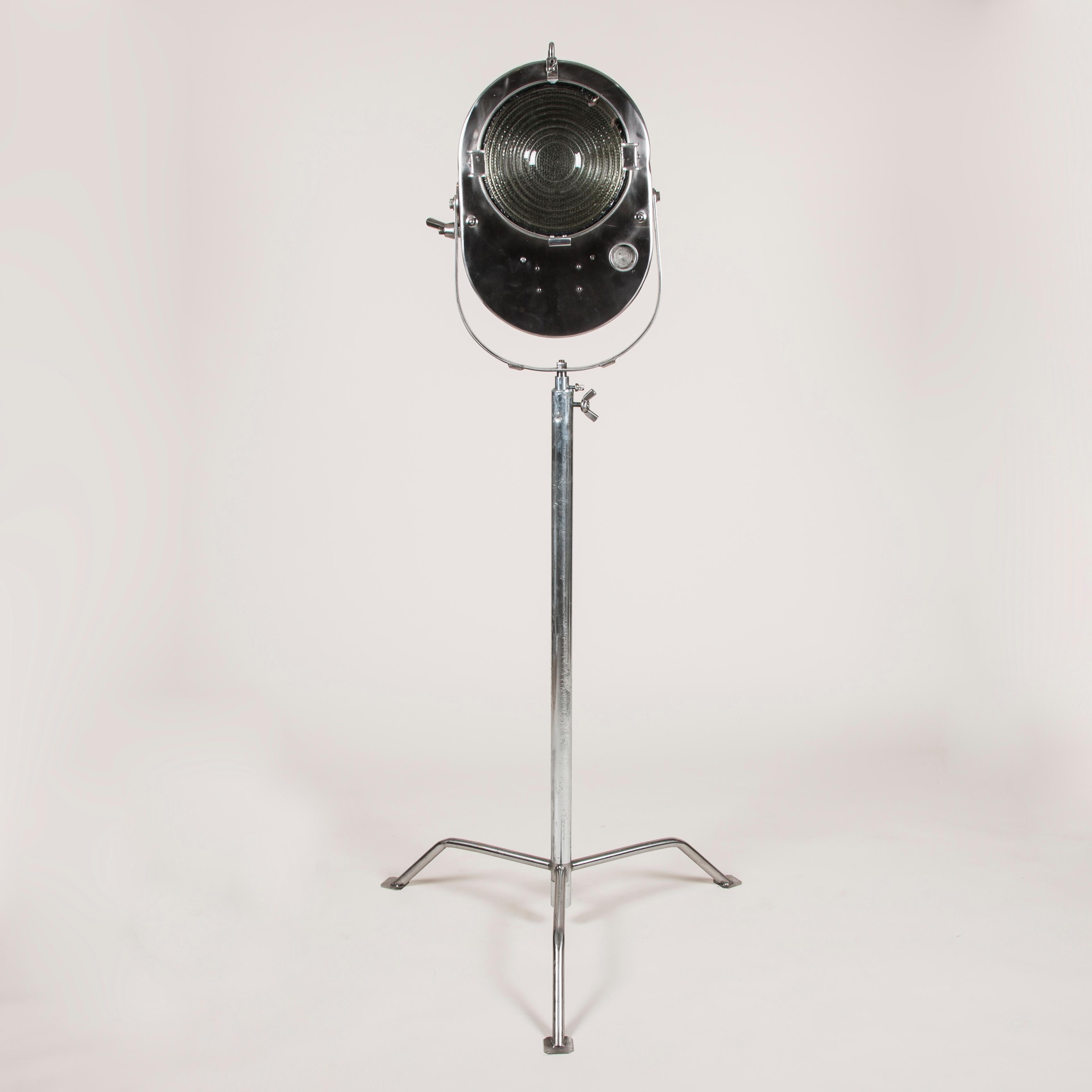 A 1950s studio spotlight, produced in the then Czechoslovakia. 

With Fresnel front lens.

Wired for domestic electricity.

Height adjustable. 

Distance between feet of tripod 31 inches.

In 2 parts, the light head and later