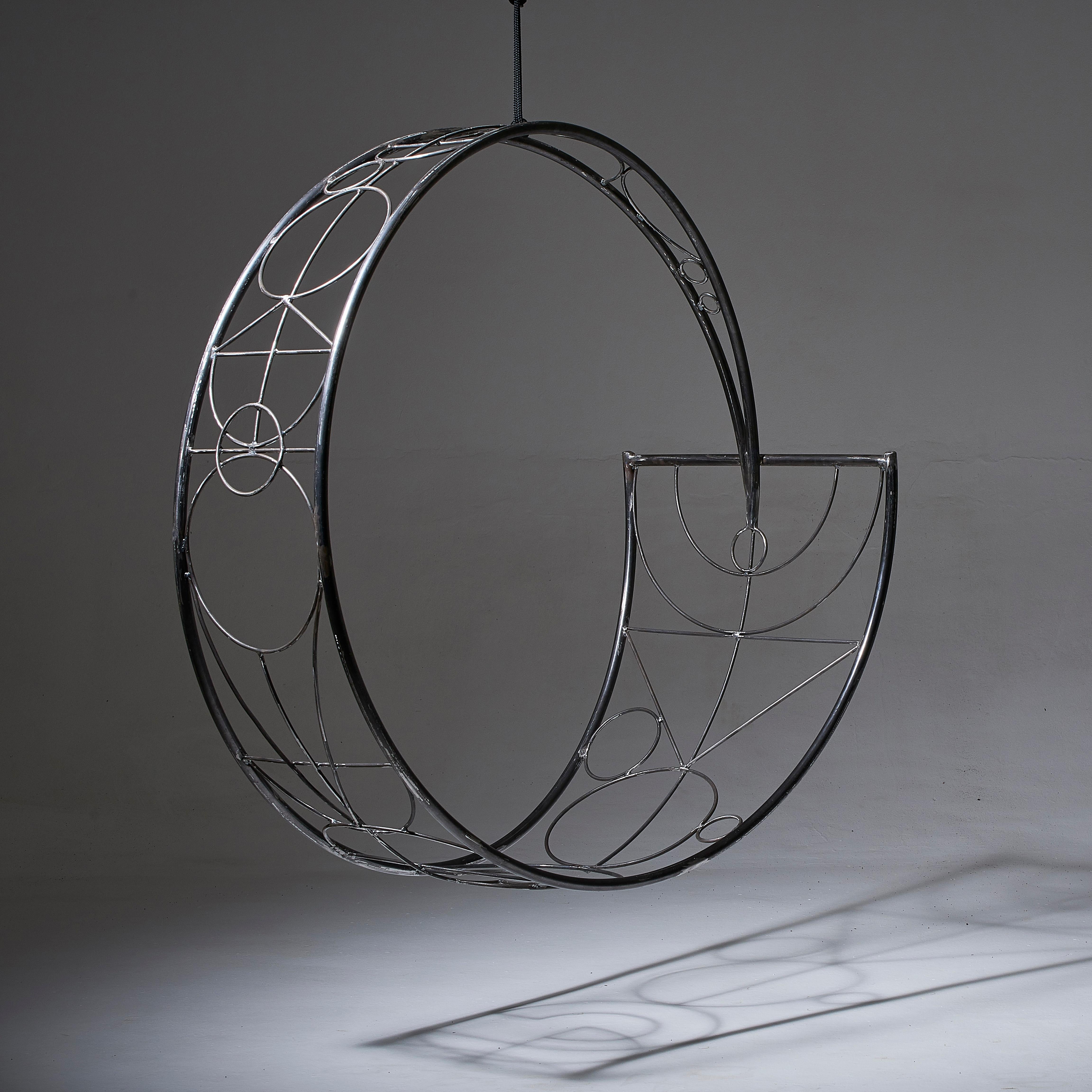 The WHEEL swing seat is sculptural and dynamic. Its striking circular shape lends itself for use as a functional art piece.
The chair has an open yet enveloping feel. 
The pattern detail is inspired by nature and reminiscent of the veins in