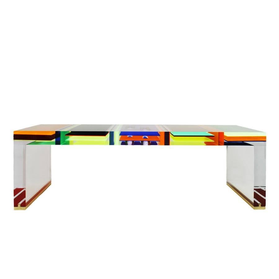 Rectangular coffee table designed by Milanese Studio Superego, made in multi-color and transparent plexiglass with seven centimetres thickness and feet of the legs finished in brass.
Through the co-operation with some of the most important Italian