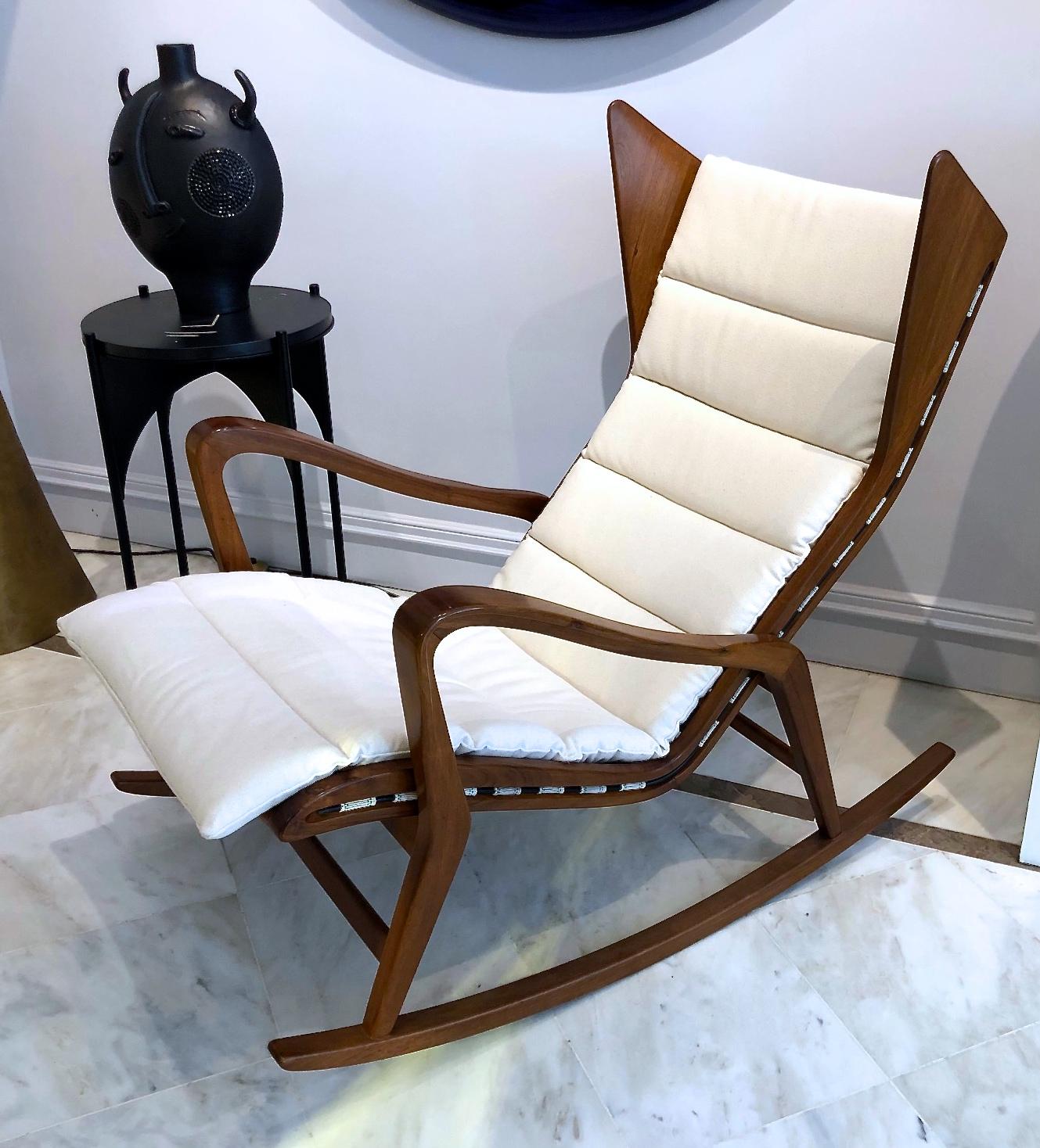 A rocking lounge chair designed by Studio Tecnico Cassina. Produced in Italy, 1955.

Executed in walnut, originals webbing but cushion has been reupholstered in white fabric.

This chair was previously attributed to Gio Ponti.

 Bibliographie: