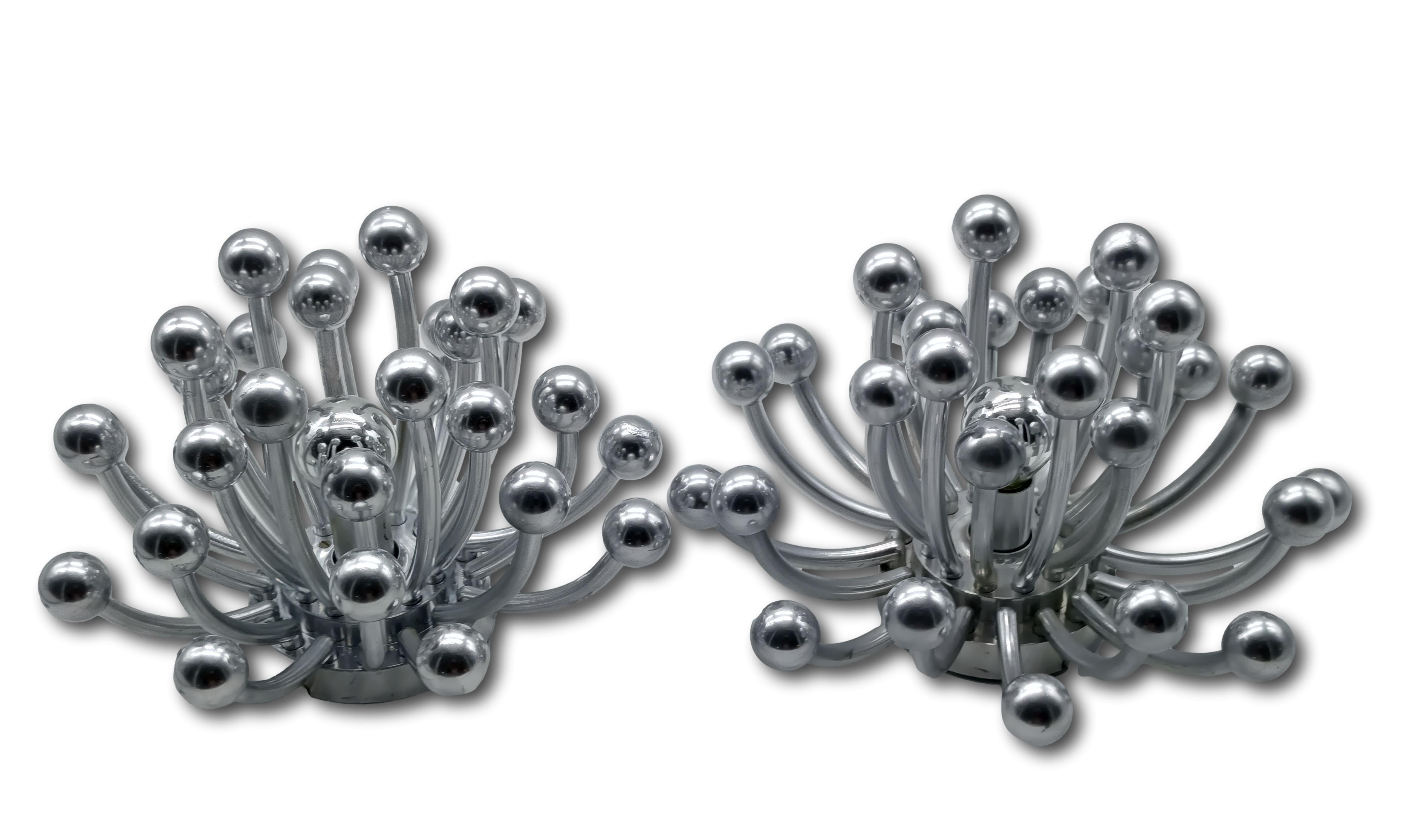 A pair of small table, ceiling or wall lamps Mod. ‘Pistillo’ in silver acrylic produced in the 1970s, these fantastic illuminations were designed in 1969 by Studio Tetrarch and produced by Valenti Italia in Italy. Its name ‘Pistillo’ refers to the
