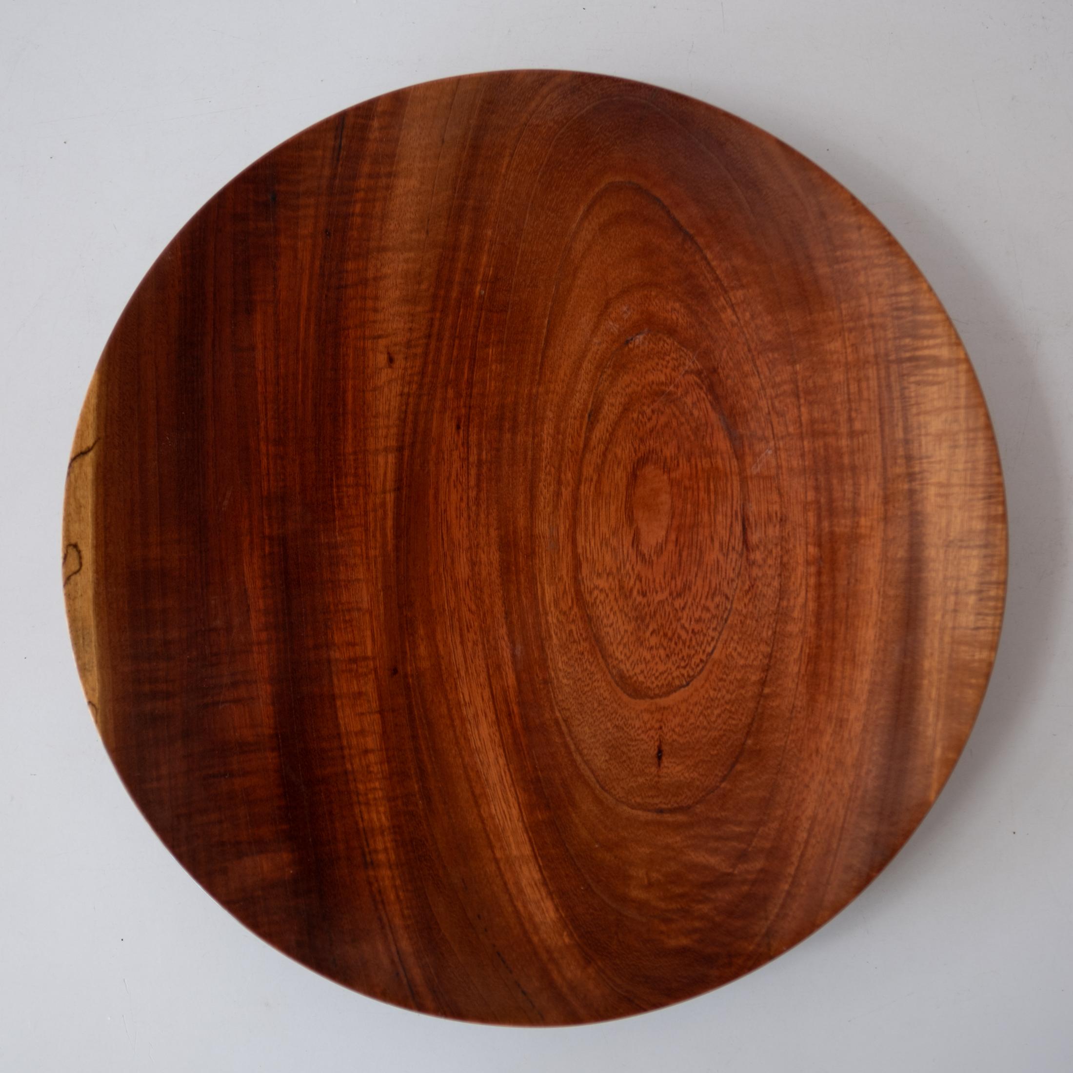 Low bowl or plate by legendary craftsman Bob Stocksdale. Beautiful grain. Signed on the bottom. This was purchased from Pamela Weir-Quiton, who acquired it directly from Bob Stocksdale. The piece was turned from Purple Heart wood from