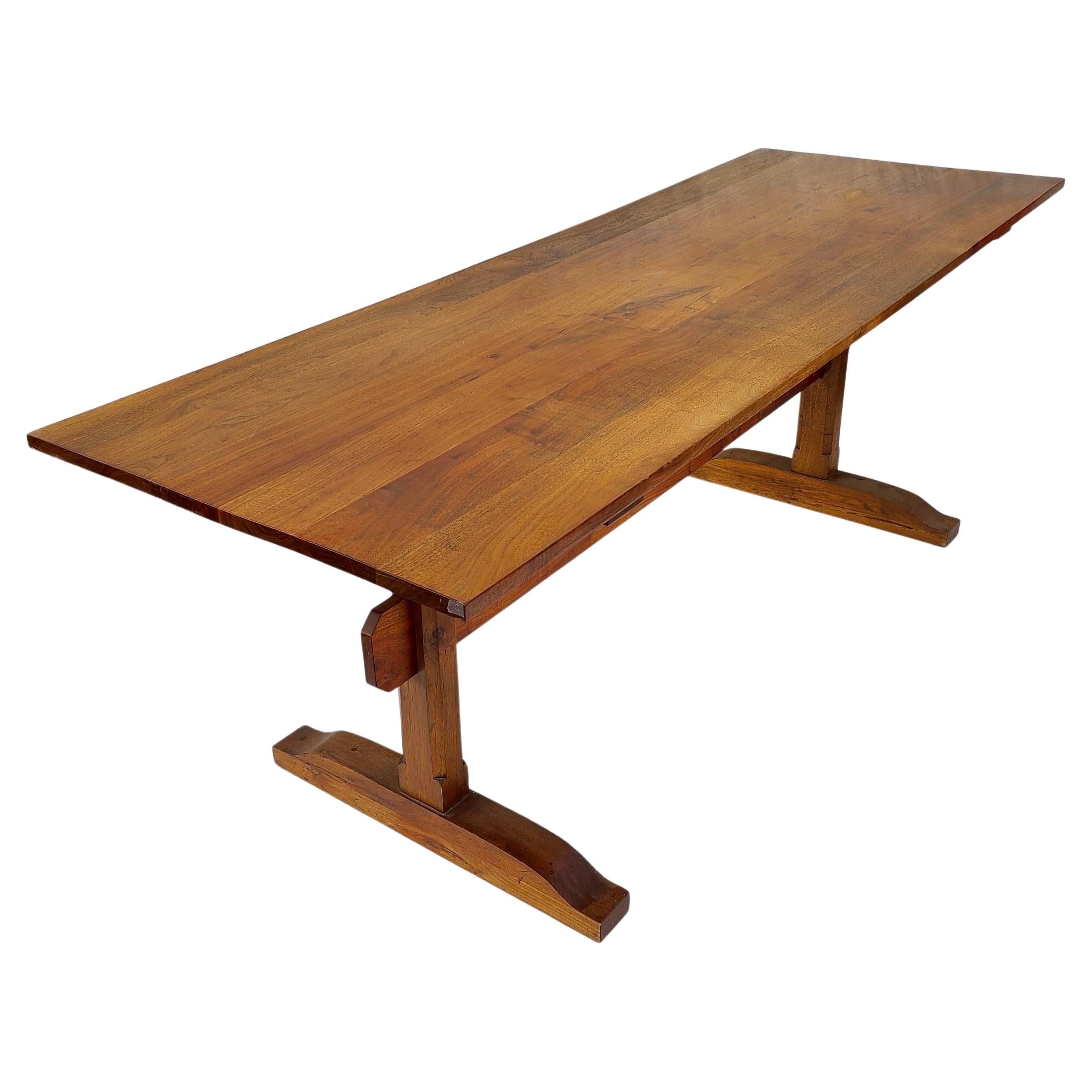 Please message us for a cost effective shipping quote to your location.

Studiocraft Walnut Trestle Dining Table.
Hand Crafted Dowel Construction. 
Long and Narrow dimensions make for cozy dining, 
and perhaps conversations at each end.
 