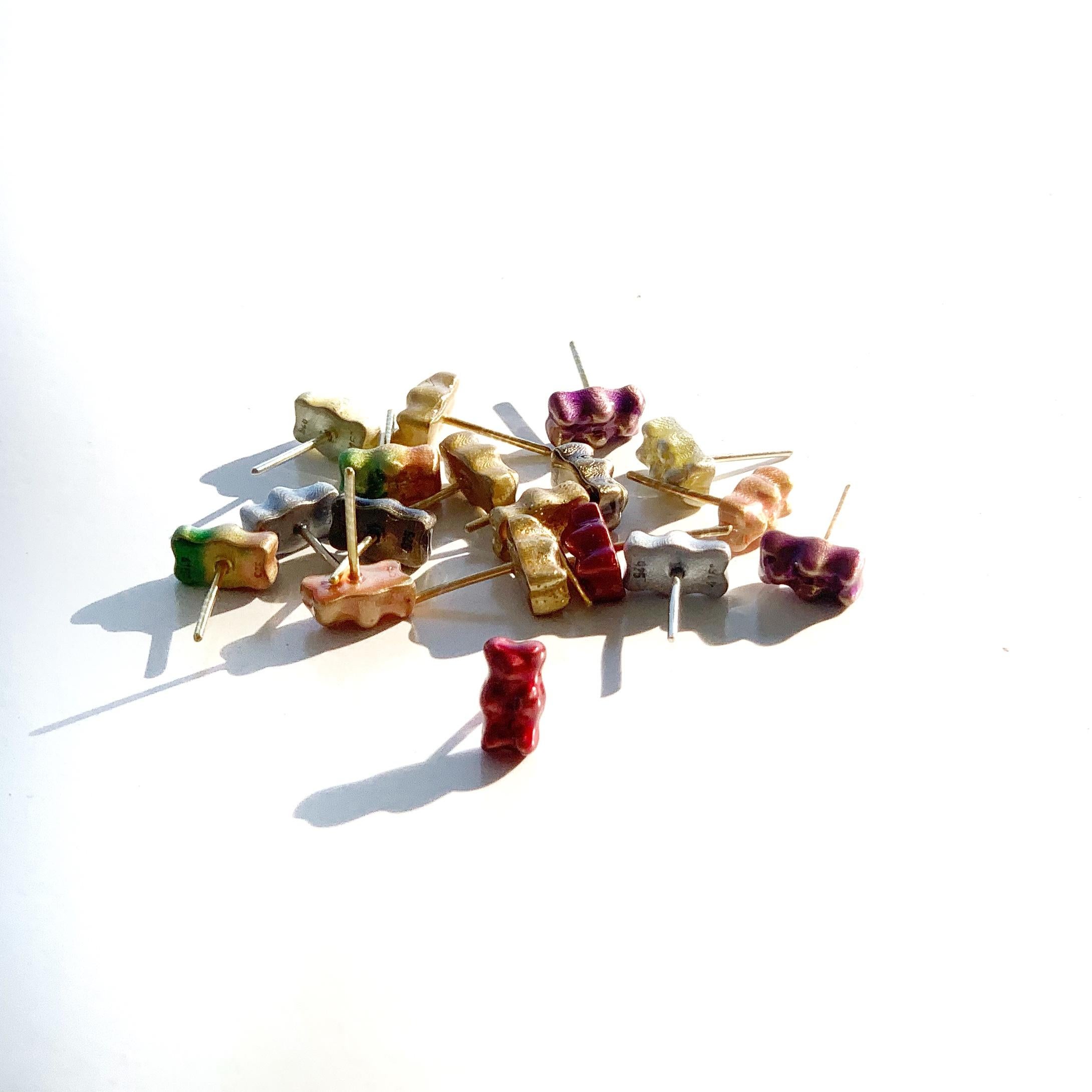 18K gold plated silver gummy bear stud earrings with transparent purple enamel coverage. 

The Gummy Project by Maggoosh is a capsule collection inspired by the designer's life in New York City and her passion for breakdancing and other street arts.