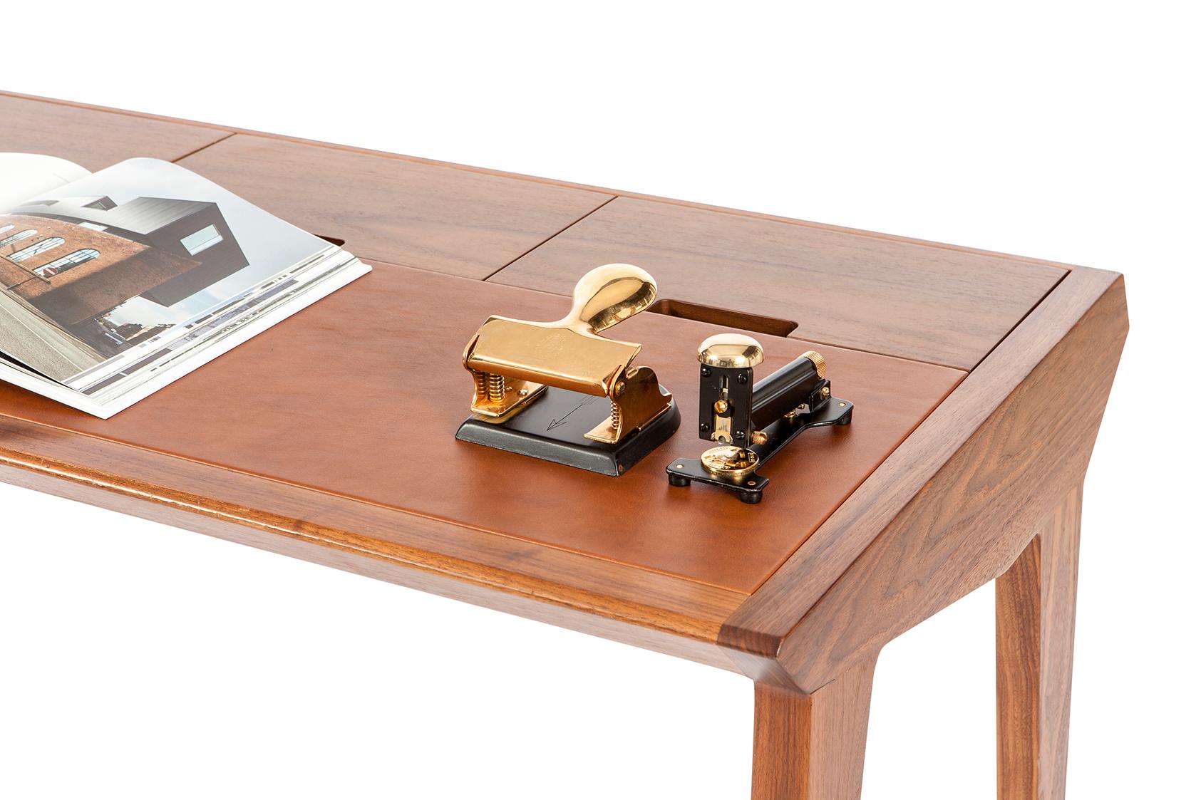 The minimalistic approach for the office desk.
With 3 secret compartments, working is now neat.
The study desk consists solid walnut/oak body and a leather writing area.
Writing Desk.
