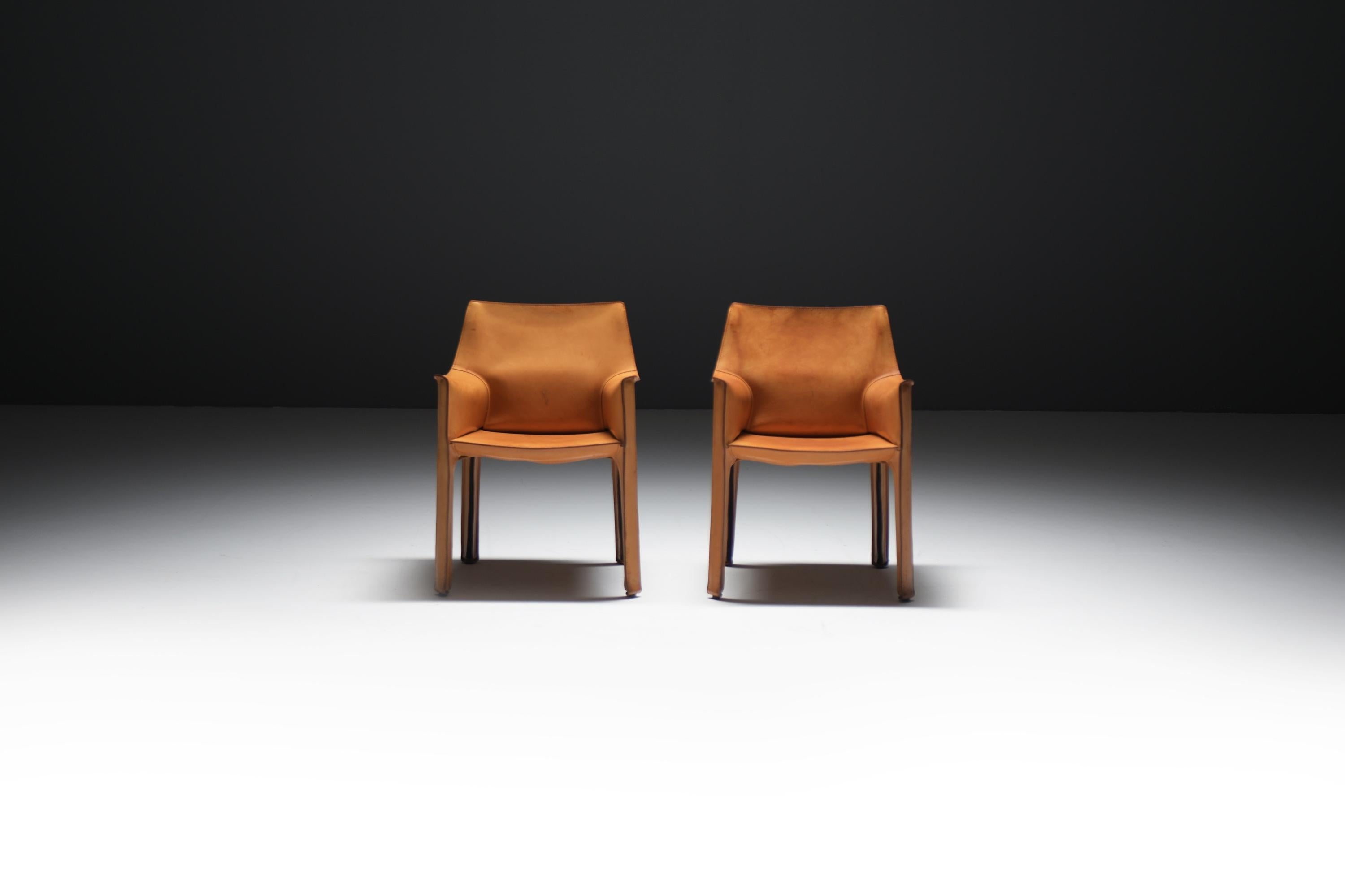 A perfect set of iconic Cab 413 dining chairs, crafted in natural leather. These exceptionally comfortable and stylish armchairs feature a gorgeous patina that only enhances their beauty over time.

Designer : Mario Bellini
Producer :