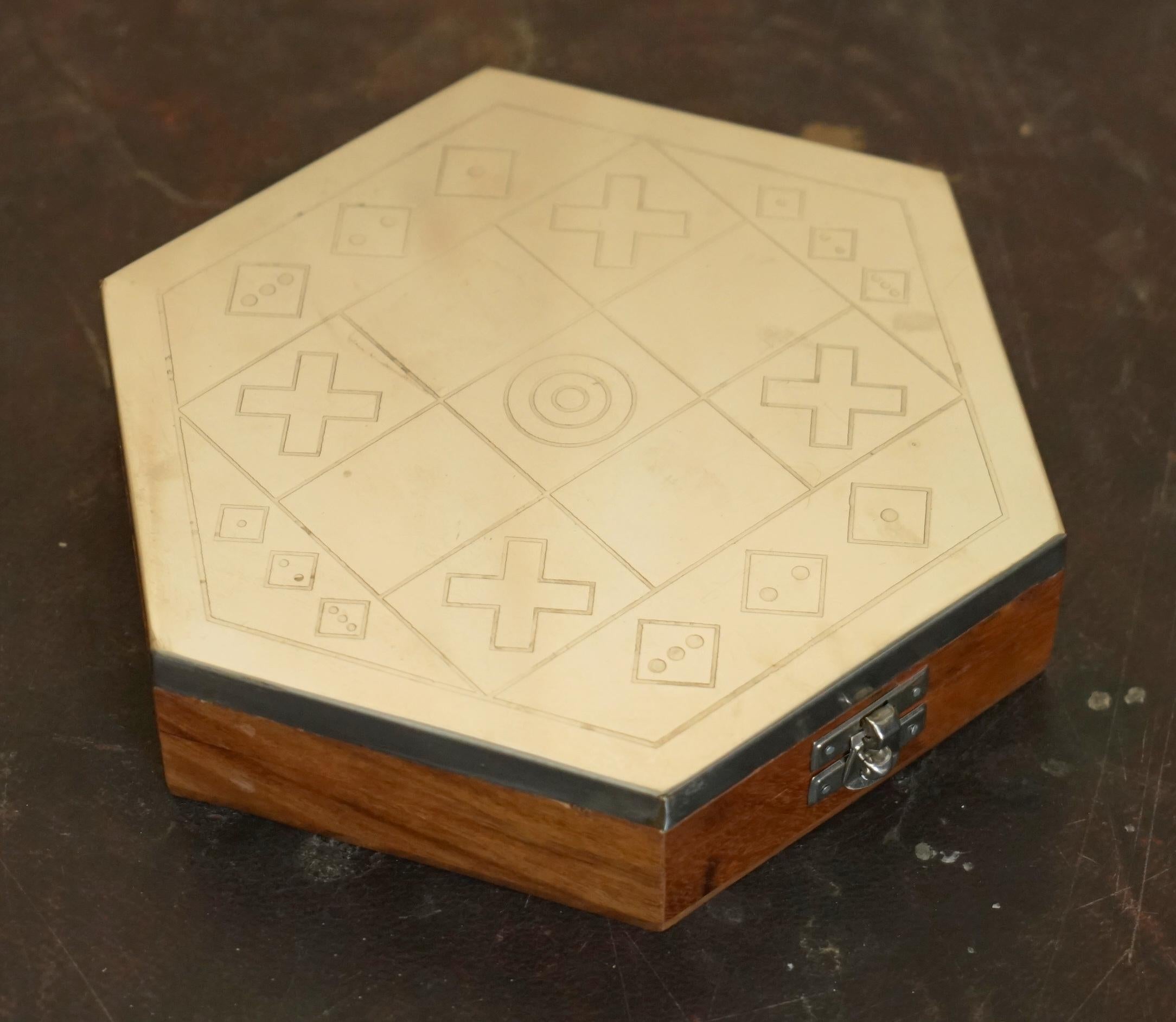 Royal House Antiques

Royal House Antiques is delighted to offer for sale this lovely vintage noughts and crosses chrome topped game with poker dice set inside

A very well made example, ideal for travel, the top is engraved with the board

The