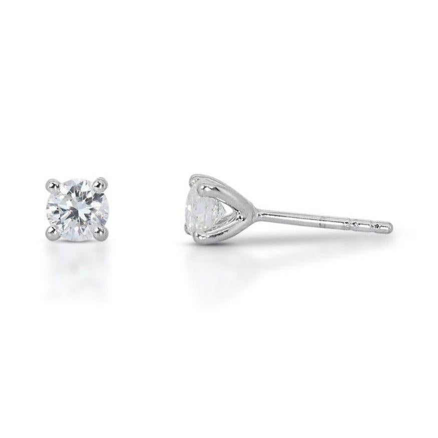 Round Cut Stunning 0.95ct Solitaire Diamond Stud Earrings set in gleaming 18K White Gold For Sale