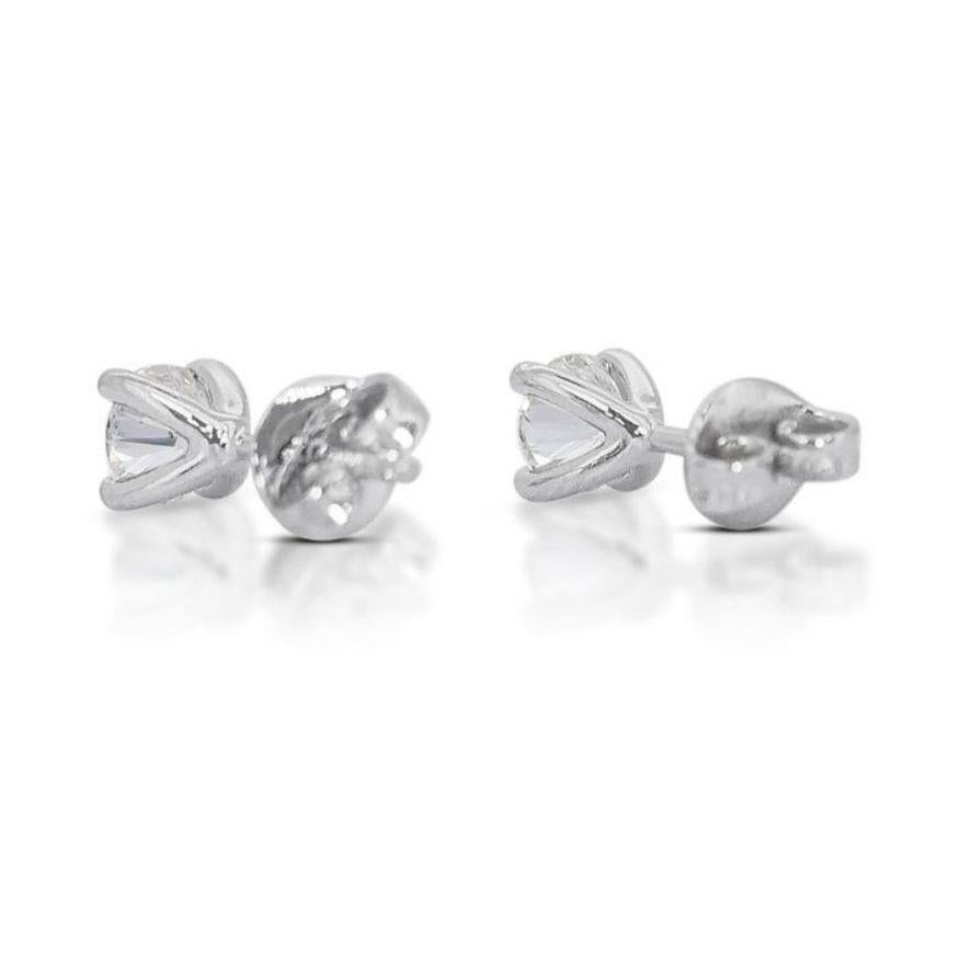 Stunning 0.95ct Solitaire Diamond Stud Earrings set in gleaming 18K White Gold For Sale 1
