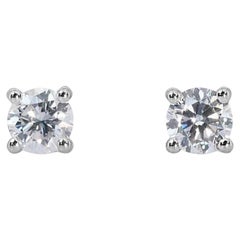 Stunning 0.95ct Solitaire Diamond Stud Earrings set in gleaming 18K White Gold