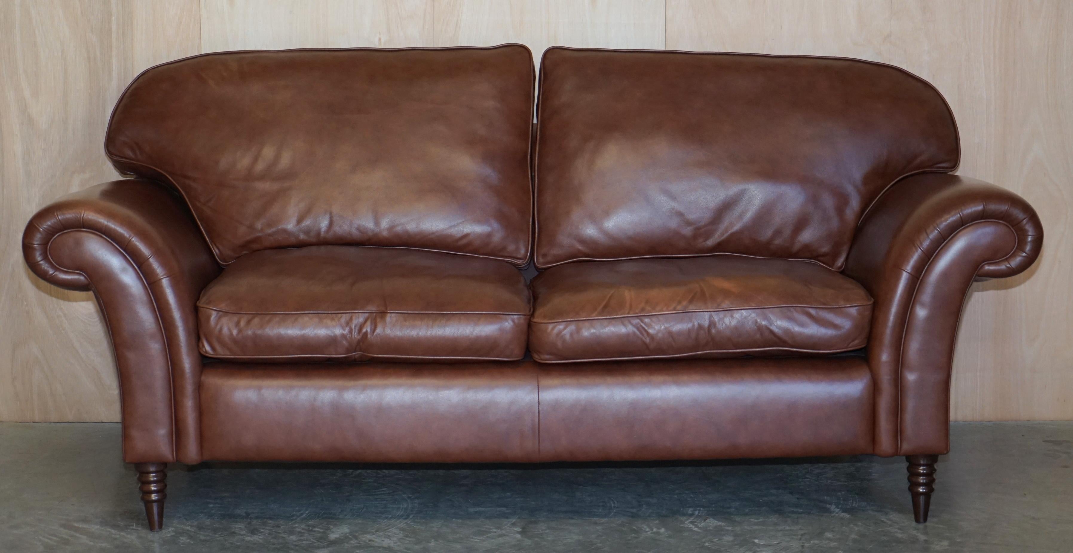 We are delighted to offer for sale this lovely Laura Ashley, Mortimer II heritage brown leather three seat sofa with castors

The sofa is very comfortable, it has fibre filled cushions which feel like feathers but retail there shape better

In