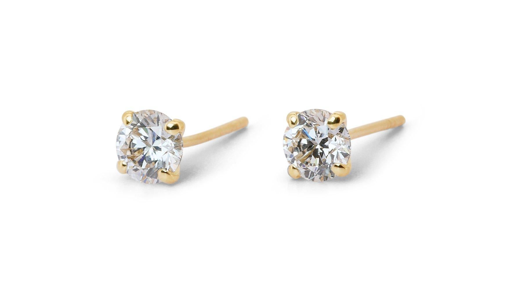 Stunning 1.00ct Triple Excellent Ideal Cut Diamonds Stud Earrings in 18k Yellow Gold - GIA Certified

Enhance your elegance with these stunning diamond stud earrings, each set in luxurious 18k yellow gold. Featuring two brilliant round diamonds with