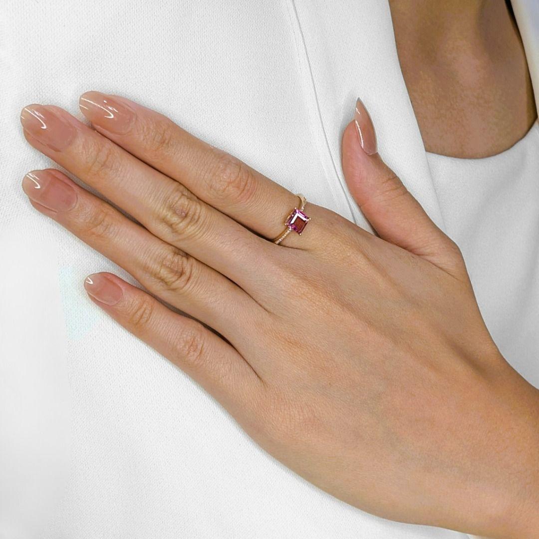Just imagine this exquisite ring gracing your finger! The soft, romantic glow of 18K rose gold beautifully complements the deep, captivating purple of the 1.08ct princess cut tourmaline. It's truly a gemstone that draws you in! Surrounding this