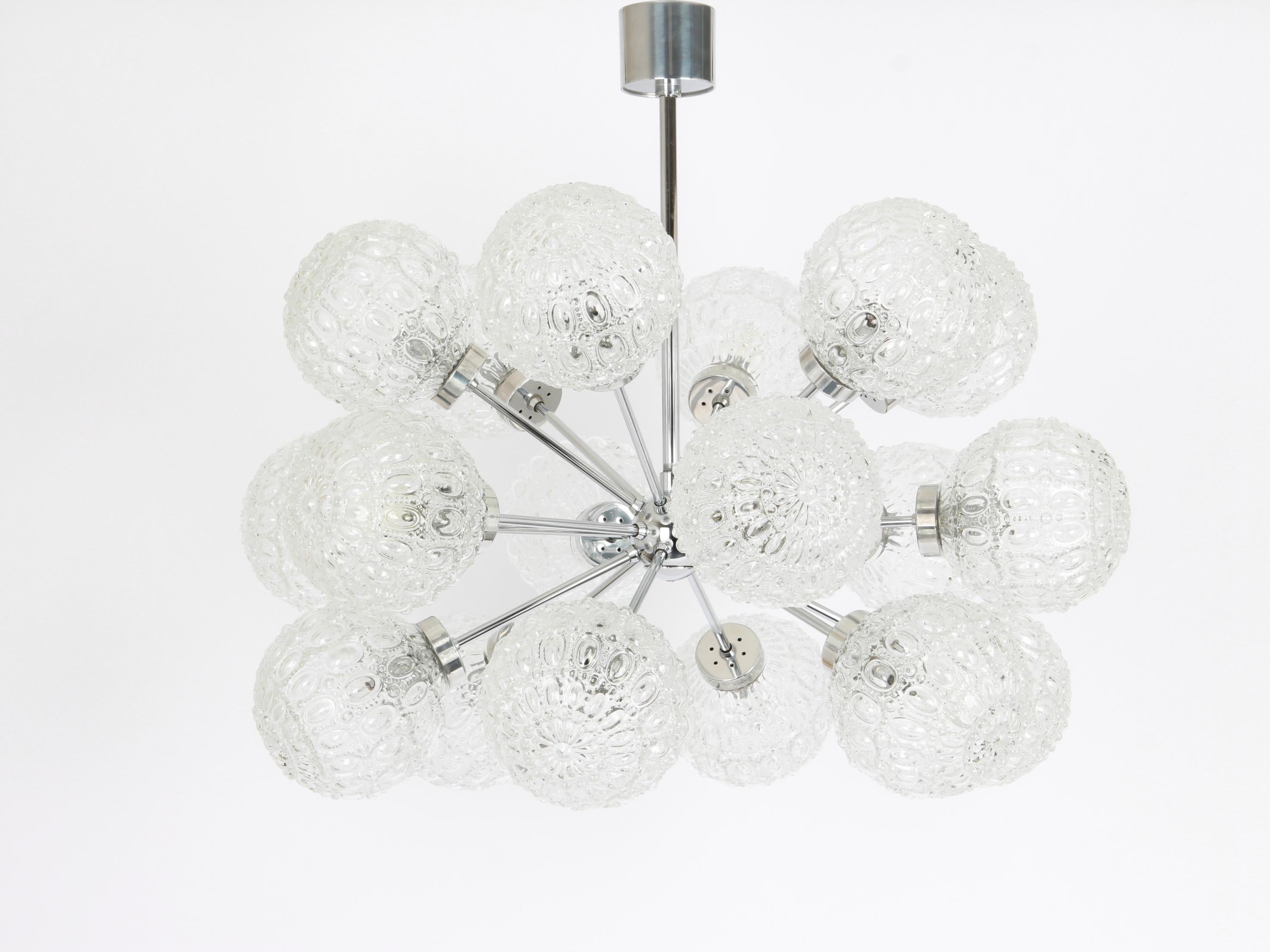 Stunning 18-arm Sputnik chandelier with 18 glass shades by Richard Essig, Germany, 1960s
Dimensions
Height
26.7 in.- (68 cm)
Diameter
25.6 in. (65 cm)
It needs 18 candelabra size bulbs up to 40 watts each.Light bulbs are not included. It is