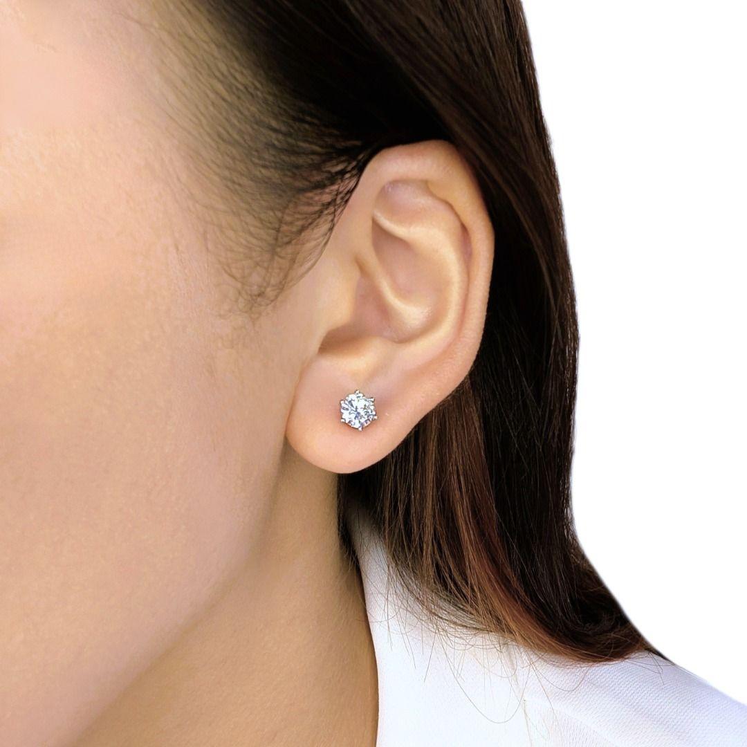A timeless expression of sophistication, these exquisite stud earrings showcase two stunning round brilliant natural diamonds, totaling 1.25 carats. Set in 18K white gold, each H-color, VVS2 clarity diamond radiates exceptional brilliance, offering