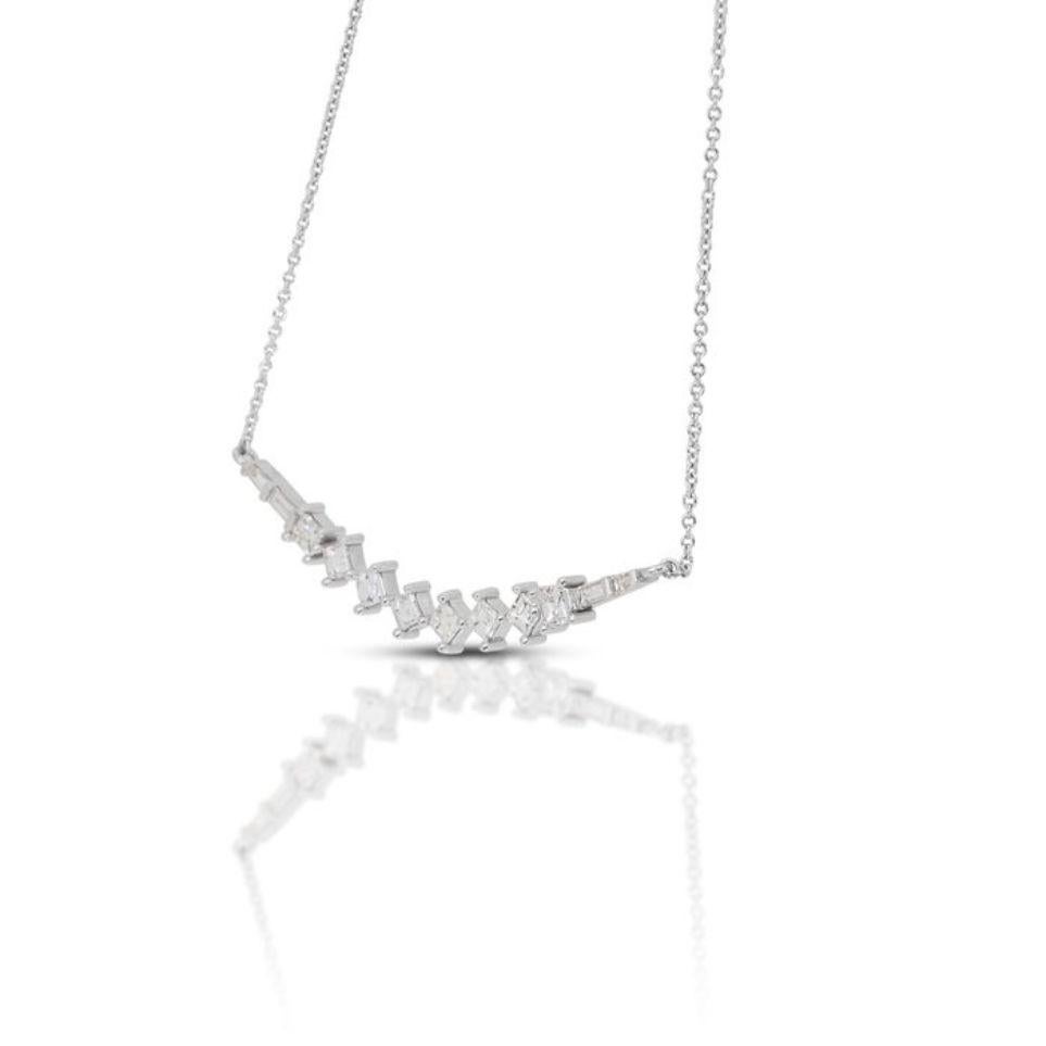 This stunning necklace features a centerpiece of six captivating square step-cut diamonds, weighing 0.72 carats. Their square step cut lends them a unique and elegant appearance, highlighting their exquisite craftsmanship and timeless beauty. With a