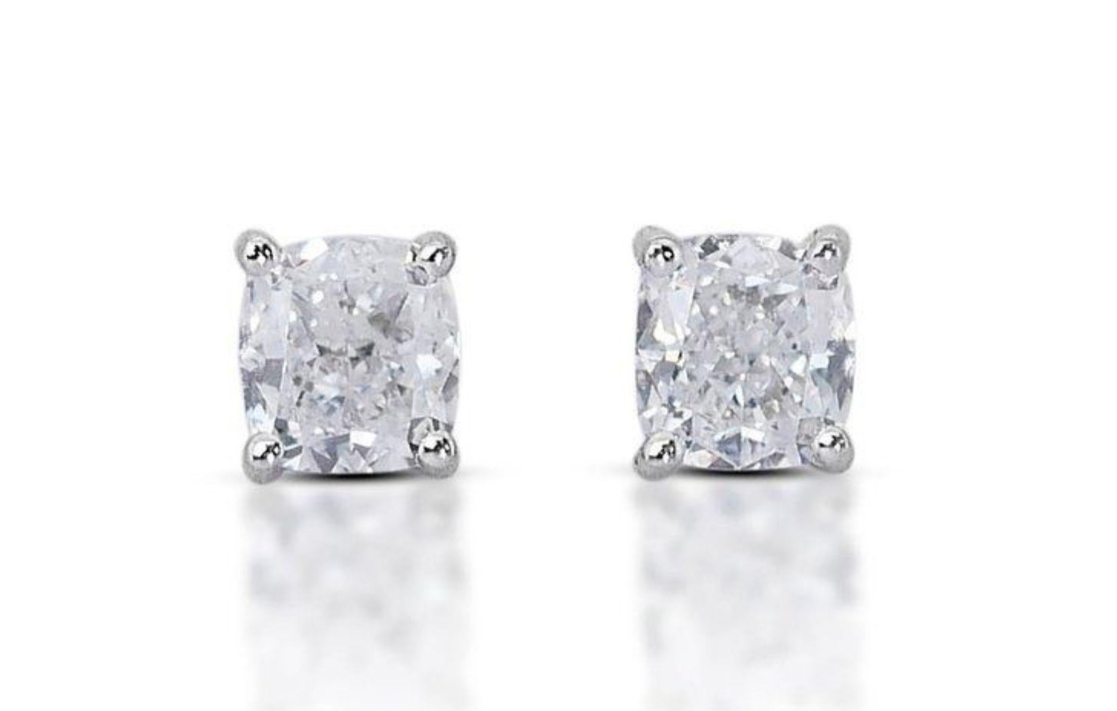 With a total carat weight of 1.4 and a combined weight of 1.83 grams, these earrings offer both elegance and luxury. Each diamond is accompanied by a GIA certificate, ensuring their authenticity and quality. This prestigious certification guarantees