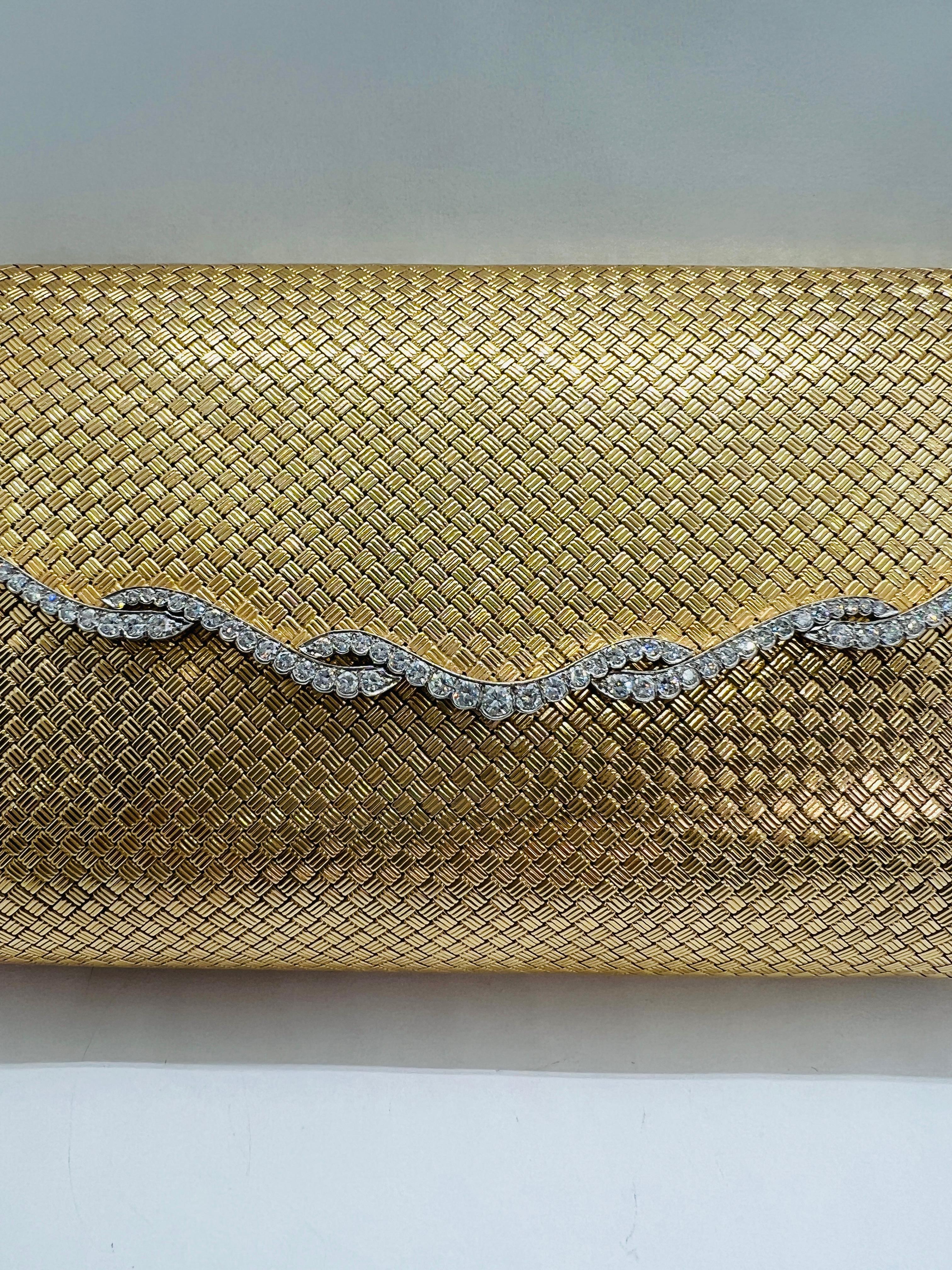 Absolutely Stunning 14K Yellow Gold and Diamond Clutch Purse! The purse measures 6.5 inches by 4 inches and weighs 483 grams! There are 80 Diamonds estimated to weigh 3.50 carats and are G-H in color and VS2 Clarity. The inside is lined in black