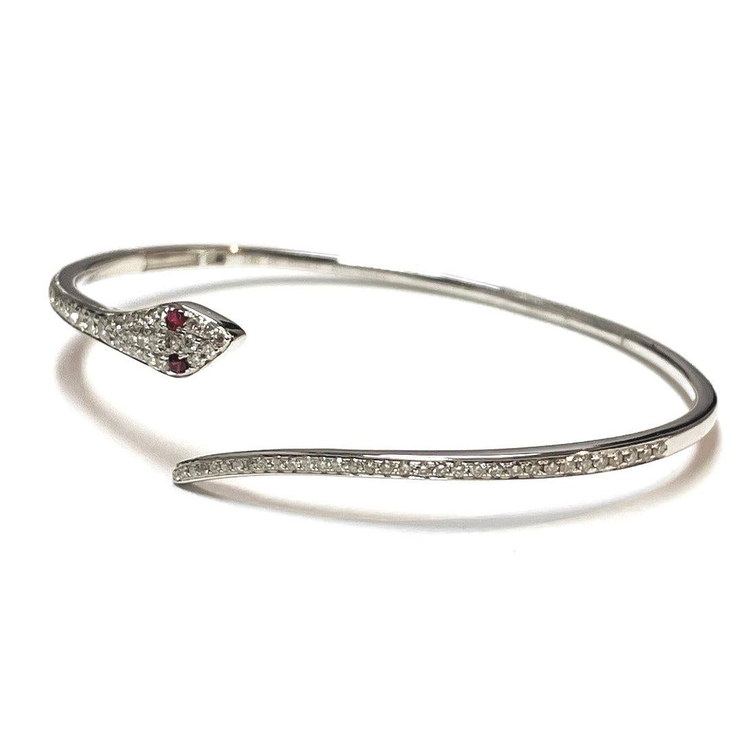 This gorgeous snake bracelet weights 8.42 grams in solid 18k white gold, approximately 0.93 total carat weight with elegant ruby eyes.

