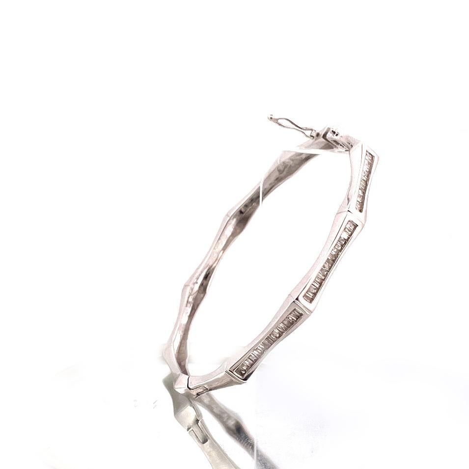 Elevate your jewelry collection with this stunning bangle crafted from 14k white gold weighing 18.28g and 
adorned with 0.75tcw of sparkling diamonds.

