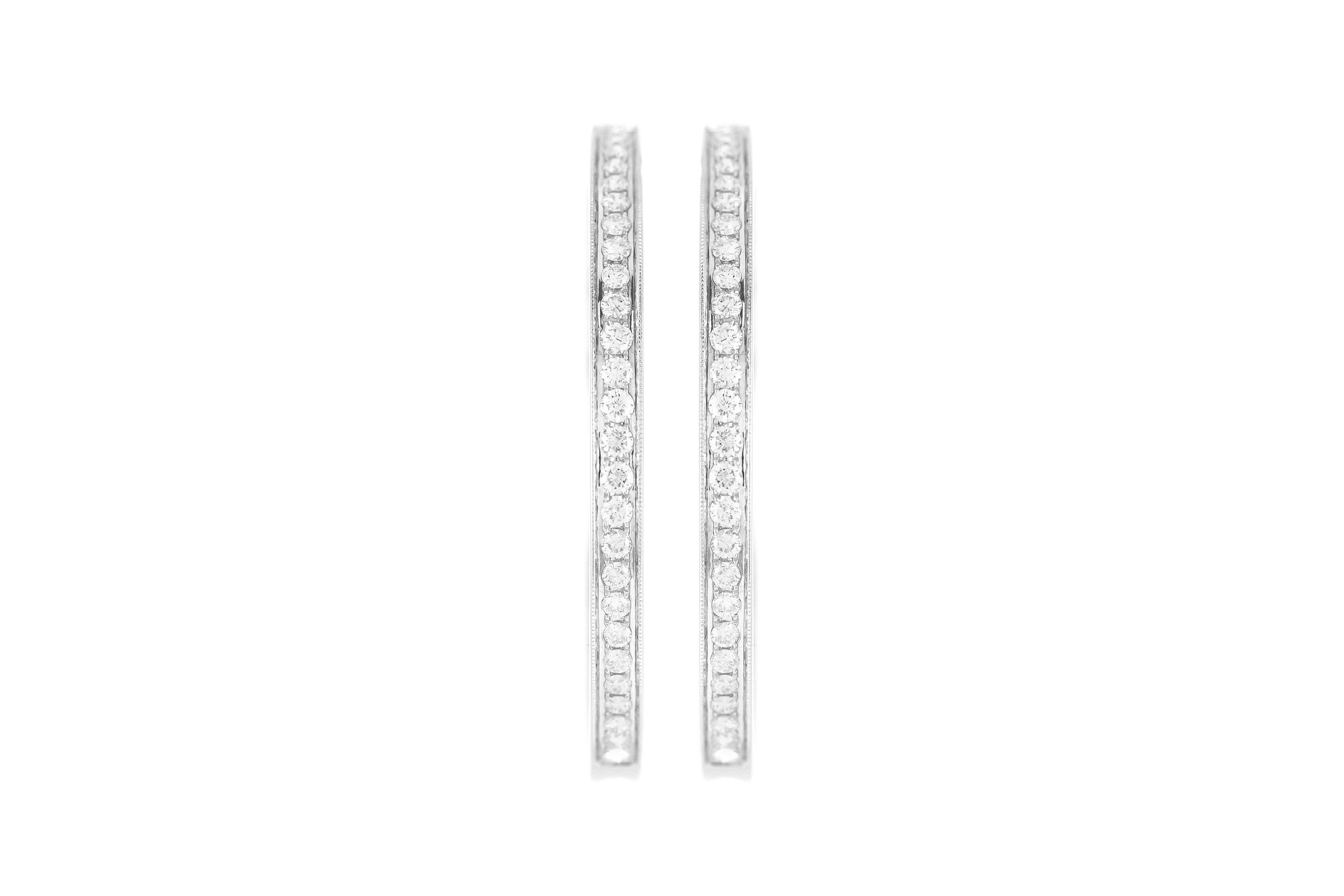 The earrings is finely crafted in 14k white gold with diamonds all around weighing approximately total of 4.00 carat.