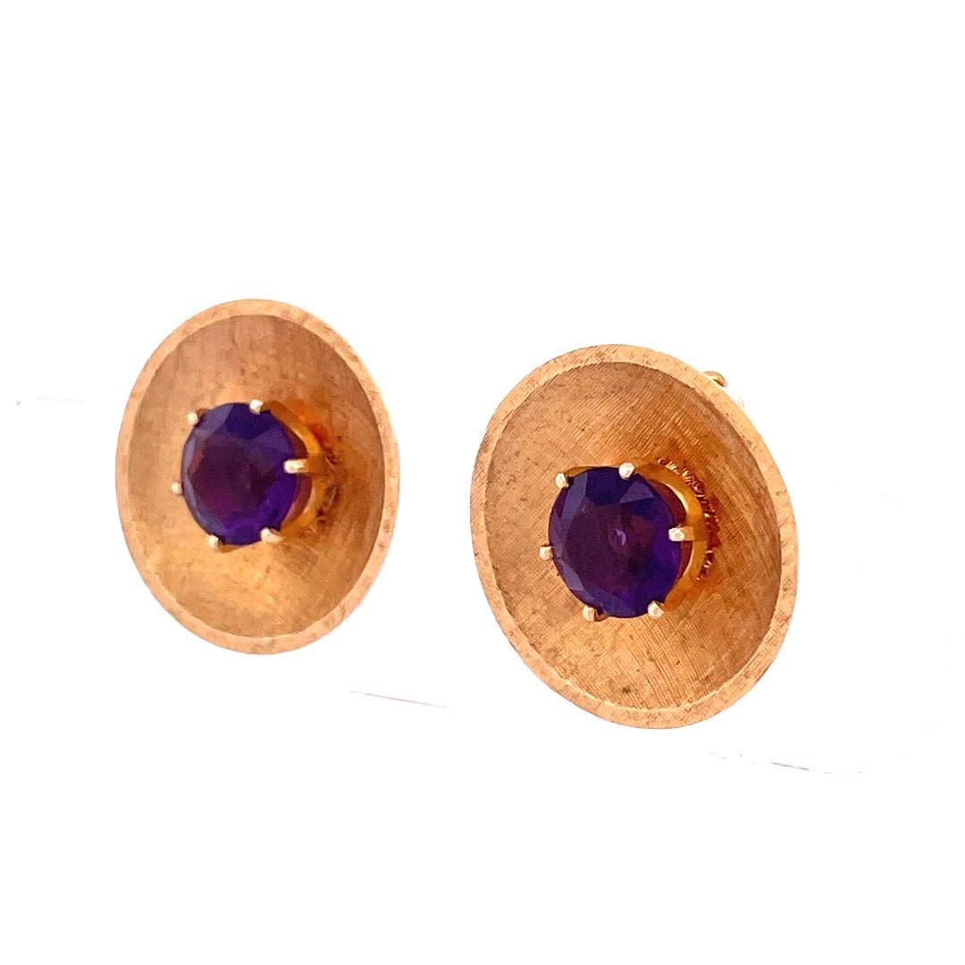 Indulge in the captivating allure of these stunning 14k yellow gold amethyst plate earrings. Each earring features a yellow gold plate that elegantly frames a mesmerizing amethyst gemstone at its center. With a total weight of 12 grams, these