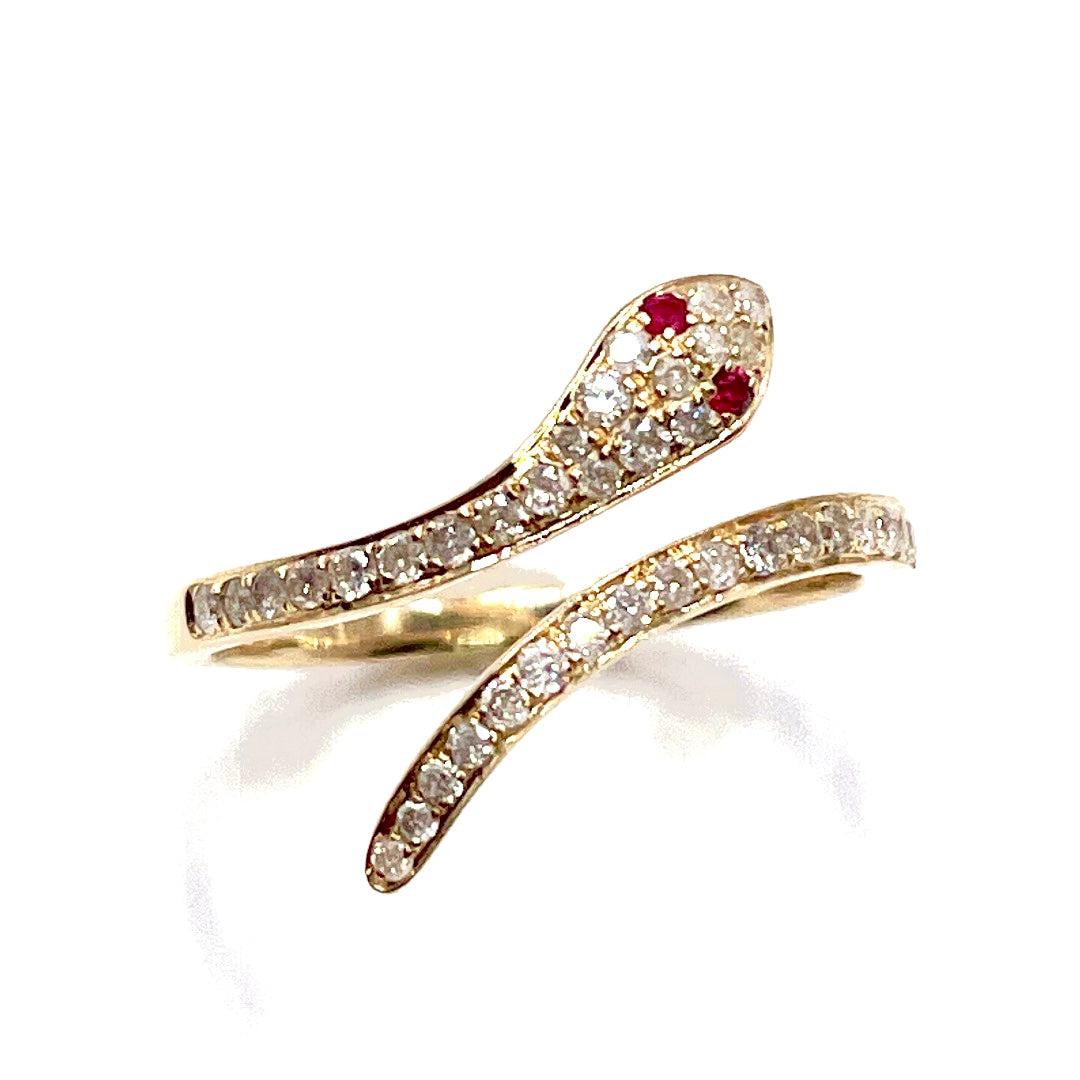 Make a statement with this  with 2 emerald eyes on a pave diamond polished solid gold band. The ring features a unique and edgy design with a snake that wraps around the finger. 
 
