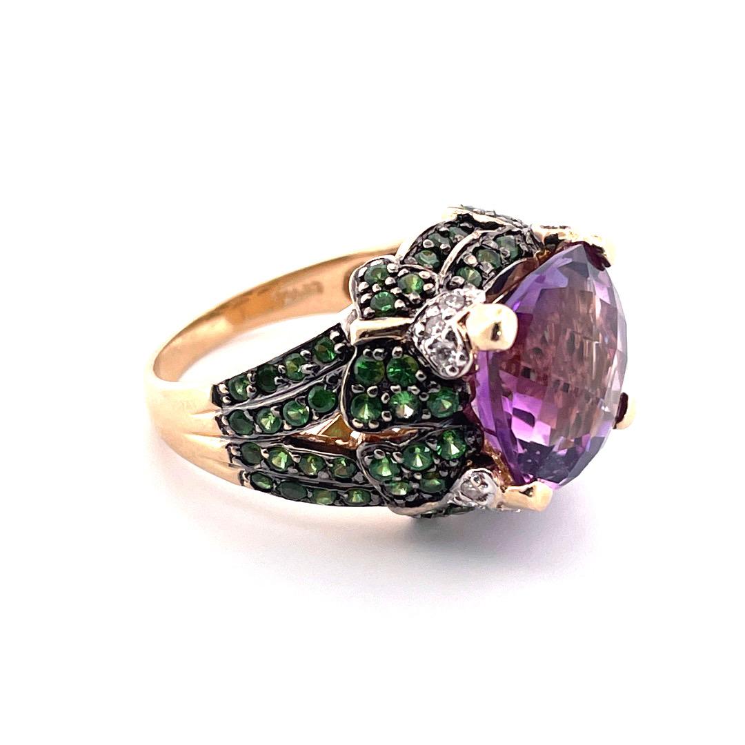 Stunning 14K Yellow Gold LeVien Amethyst Tsavorite Diamond Ring

This exquisite LeVien ring is a true masterpiece, crafted from 14K yellow gold(stamped 14k) with a weight of 8.9 grams. The centerpiece of the ring is a gorgeous 6ct amethyst, which is