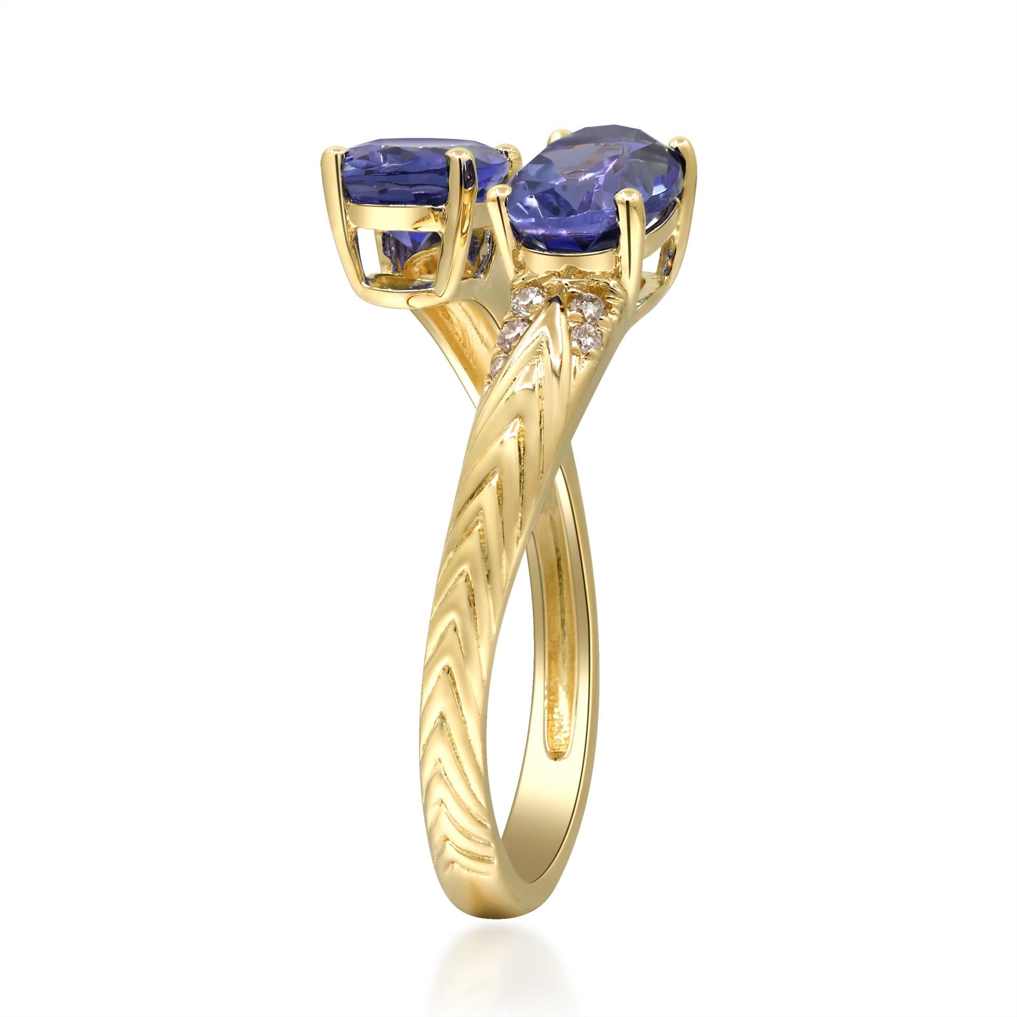 Elevate your jewelry collection with this breathtaking 14K yellow gold cuff ring, featuring two captivating tanzanite stones, each weighing 0.88 carats. The rich violet-blue hues of the tanzanite are beautifully complemented by sparkling diamond