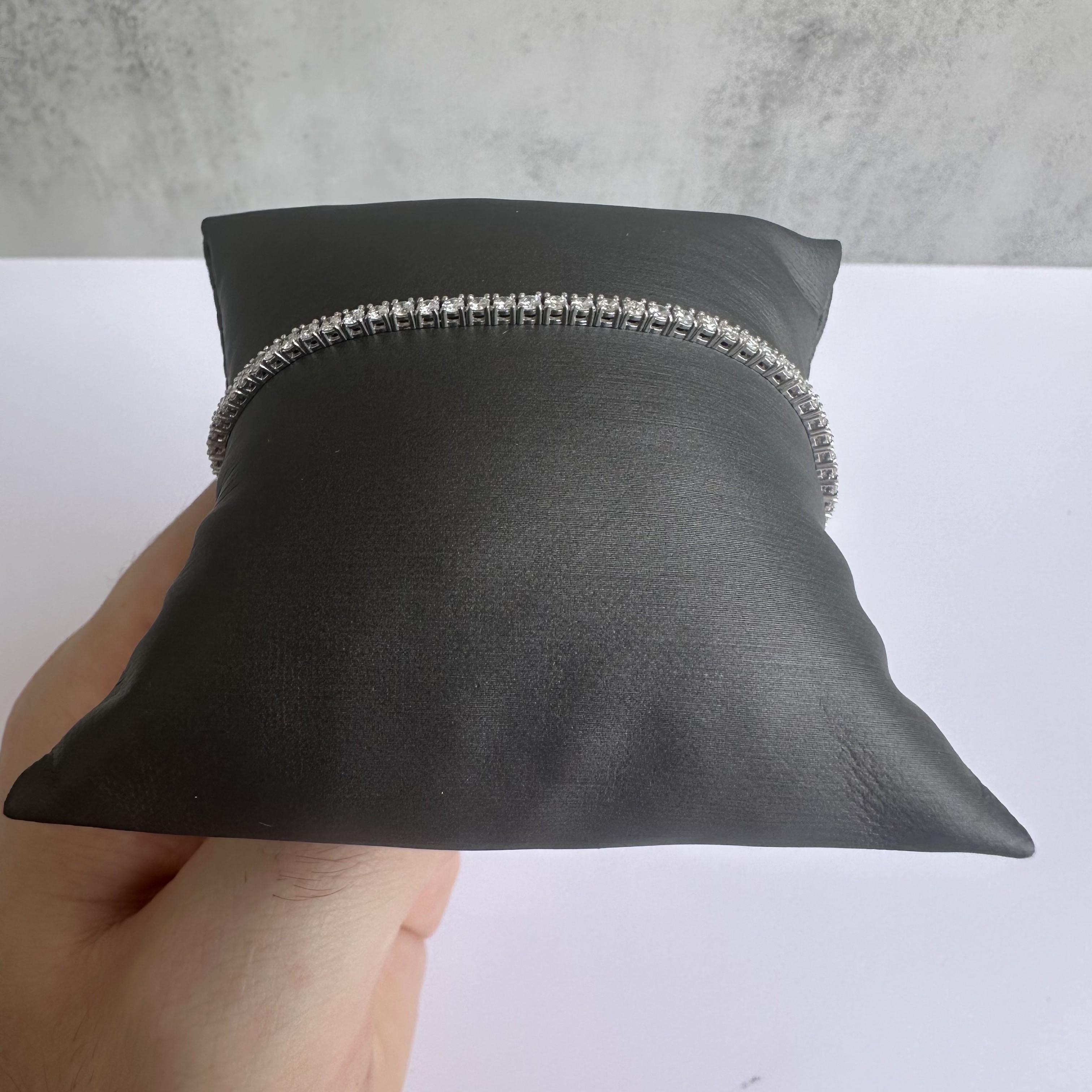 Elevate your jewelry collection with this stunning 14kt White Gold Diamond Tennis Bracelet, featuring 2.25 carats of GH SI2-I1 natural diamonds. This bracelet combines classic sophistication with modern luxury, perfect for adding a hint of sparkle