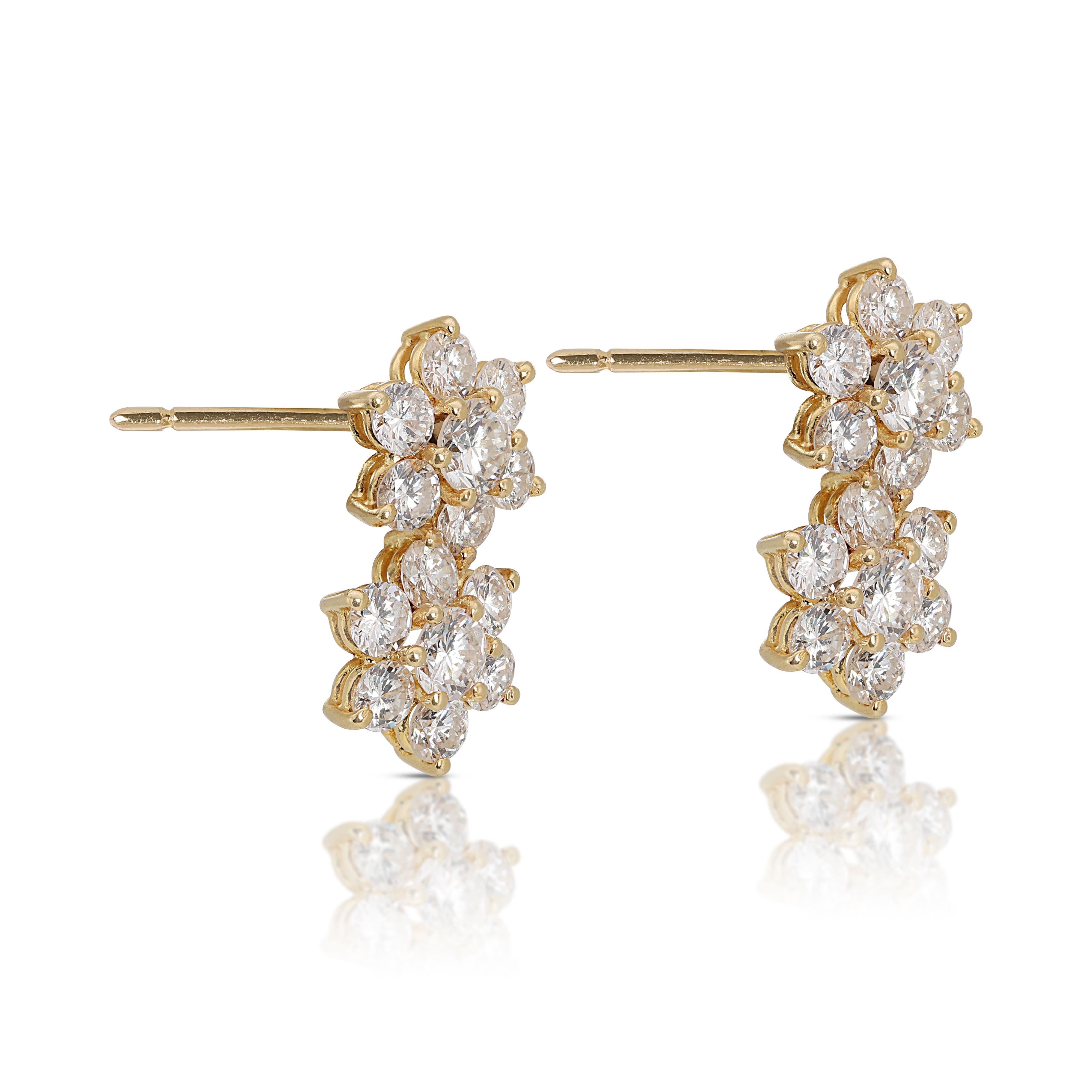 Dazzle everyone with these stunning 18k yellow gold earrings featuring 28 sparkling round brilliant diamonds with a total carat weight of 1.52ct. These captivating diamonds boast a G color grade and VS clarity, ensuring exceptional brilliance. The