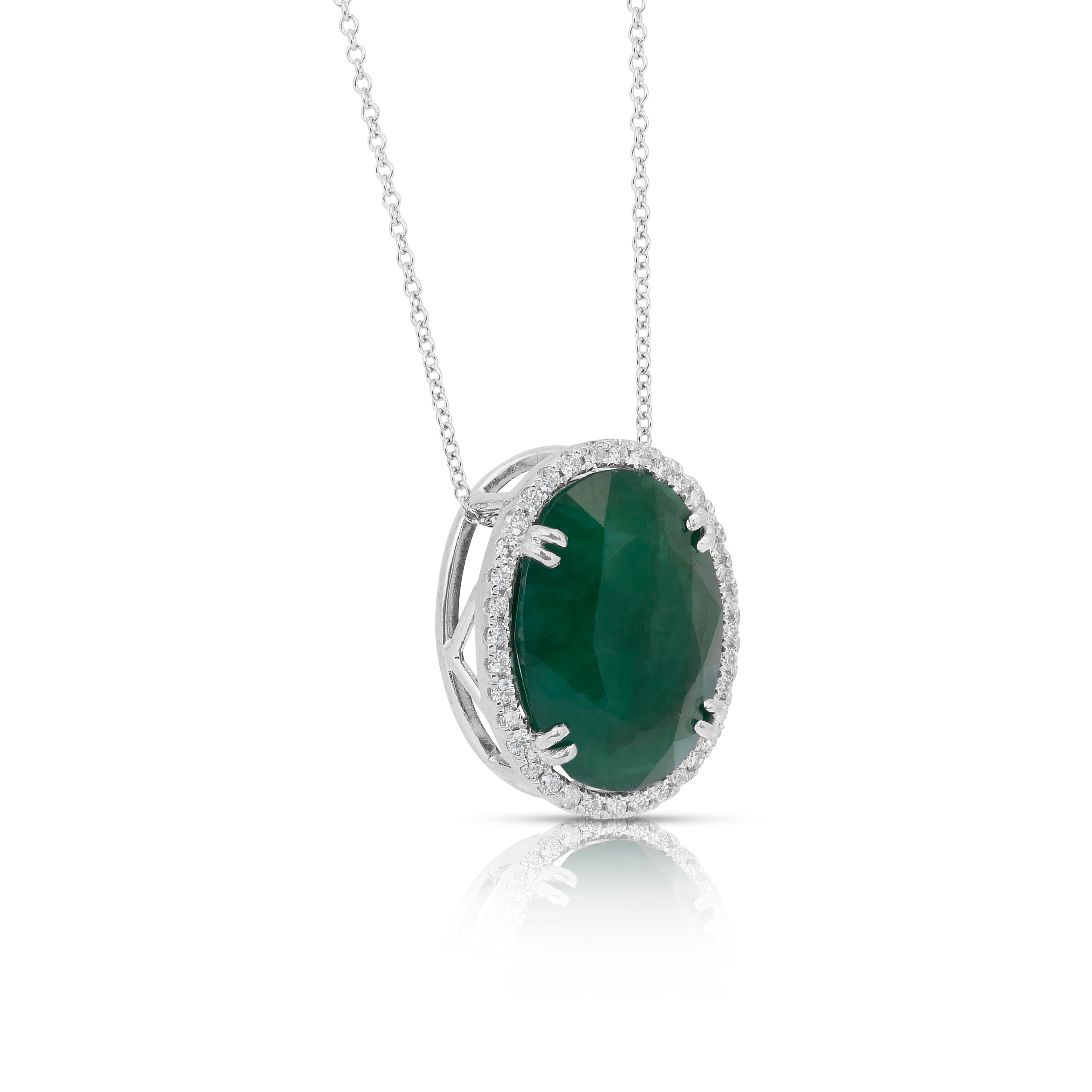 Stunning 15.30ct Emerald and Diamonds Necklace with Pendant in 18k White Gold - IGI Certified

A statement of regal luxury, this stunning necklace features a captivating 14.57ct oval-cut emerald in a lush, vivid green hue—radiating natural elegance