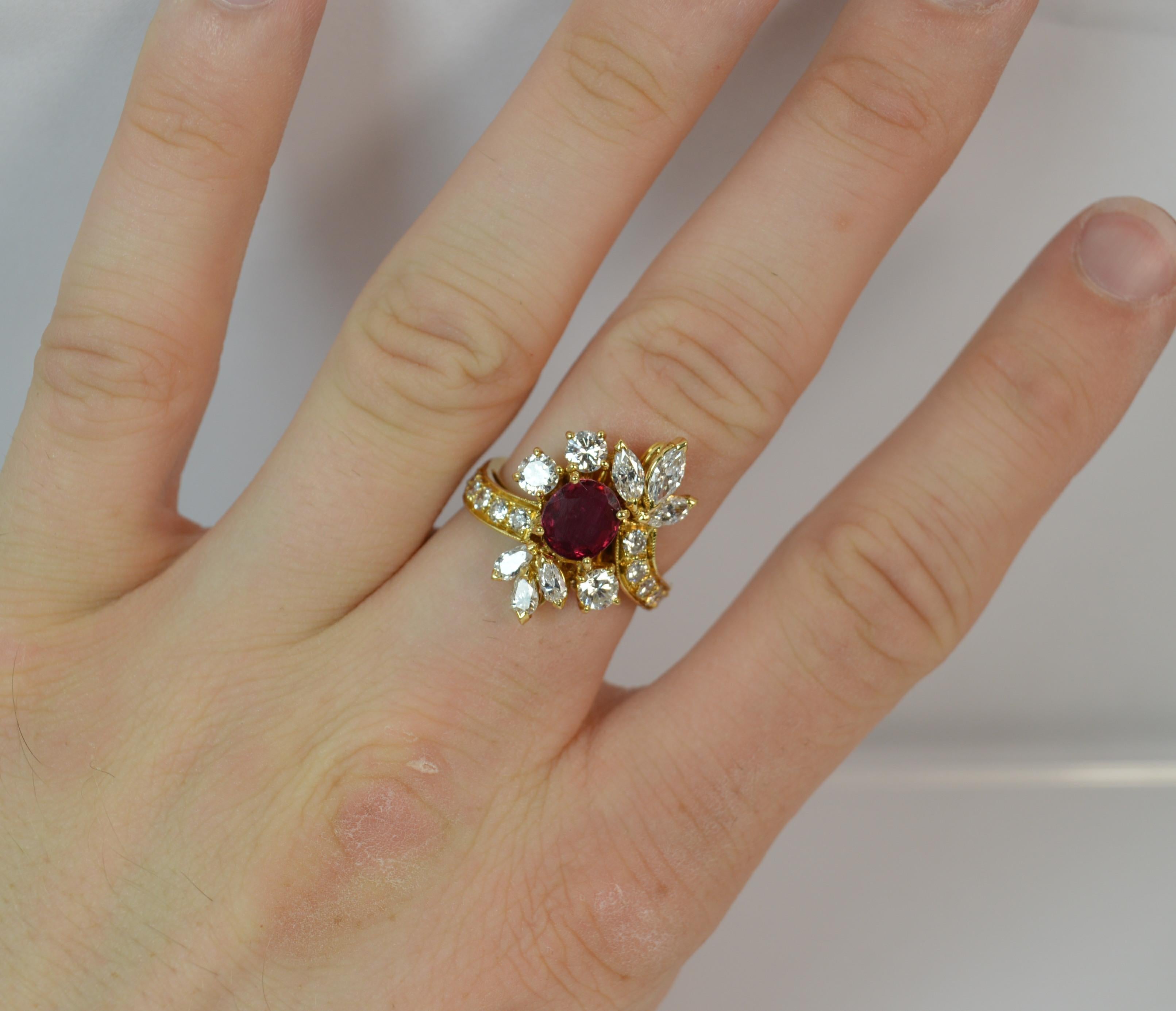
A beautiful natural Ruby and Diamond cluster ring.

​Designed with a natural ruby to the centre, 6.3mm x 7.0mm. 

​Surrounding the natural ruby are many round brilliant and marquise cut diamonds with further diamonds to the shoulders. 1.75 carats