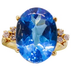 Stunning 18 Karat Blue Topaz 
Diamond Engagement Ring