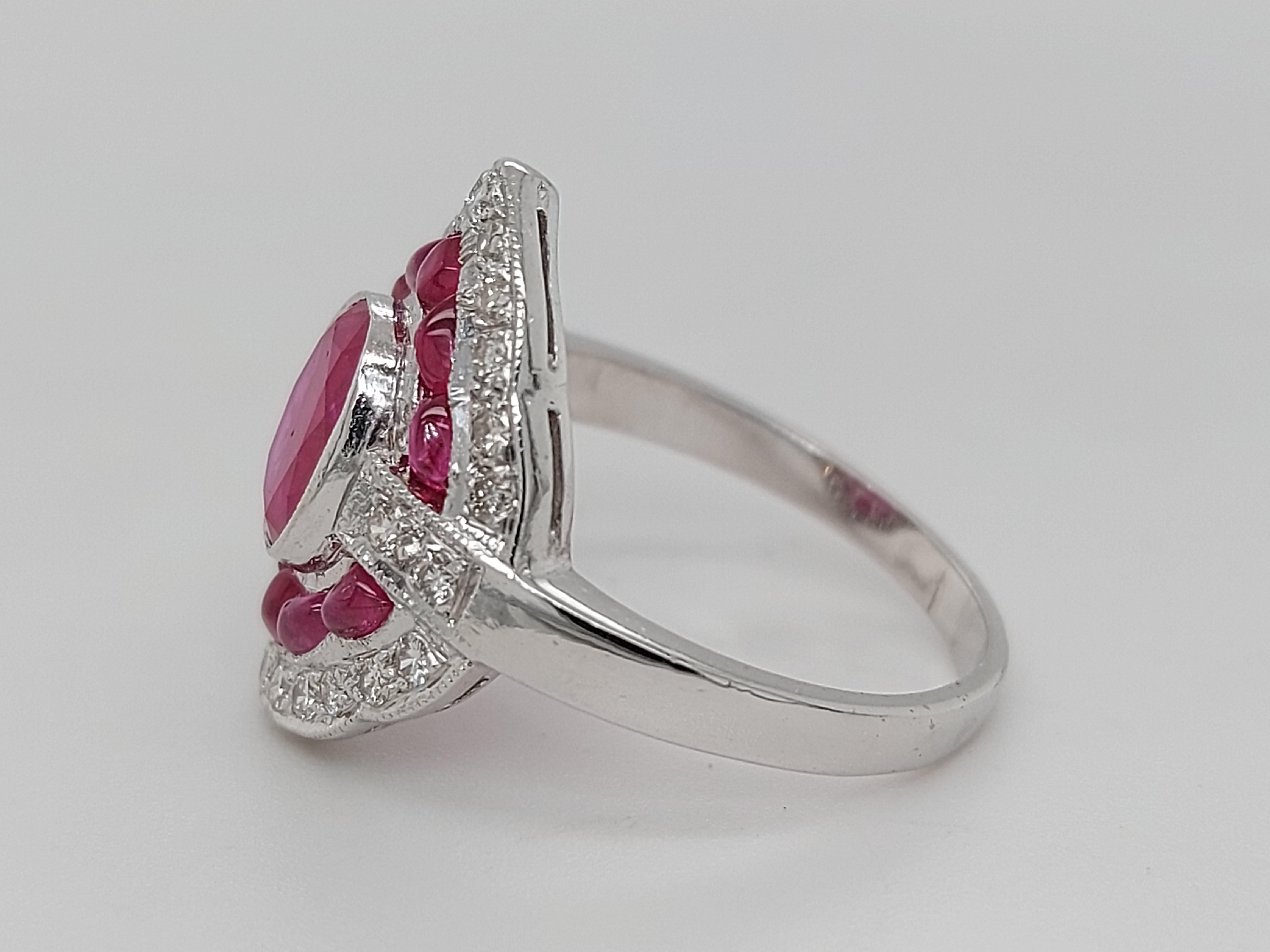 Oval Cut Stunning 18 Karat White Gold Ring with Rubies and Brilliant Cut Diamonds For Sale