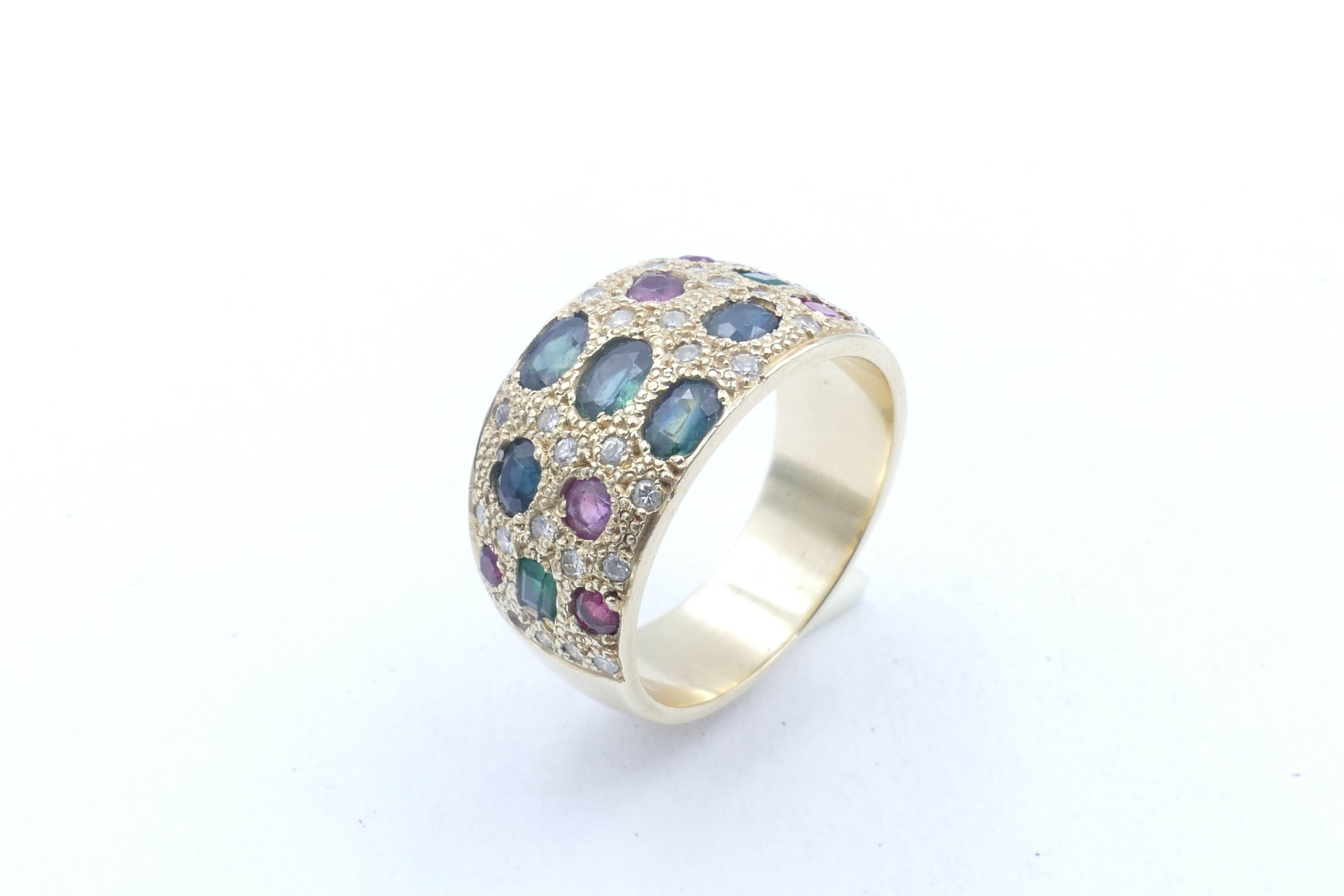 This gorgeous multi-colour Ring is, as well, studded with Diamonds, set in random pattern around the other Gemstones.
There are 5 Sapphires, Parti greenish blue, with 2 Emeralds of bluish green, as well as 6 Rubies, purplish red along with 30