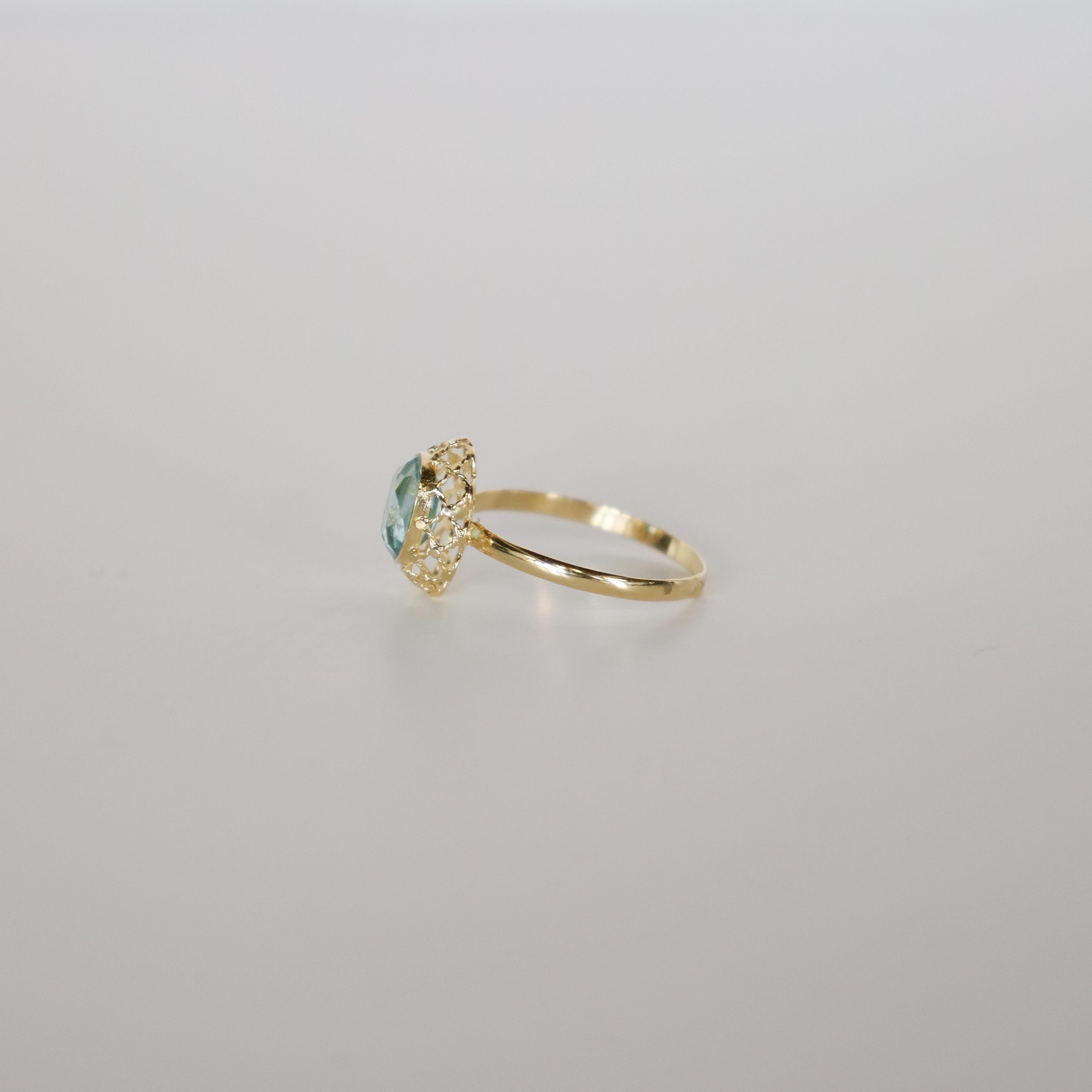 Ring aus 18k Gelbgold mit natürlichem Blautopas im Brillantschliff Damen