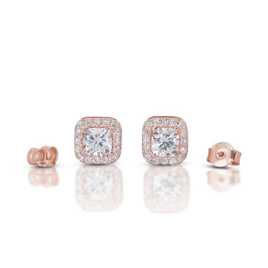 Prepare to be captivated by these stunning rose gold earrings! Each whispers luxury with a magnificent 1.63-carat cushion-cut diamond, boasting a near-colorless F-G color and exceptional clarity (VVS2-VS1). Their mesmerizing VG cut ensures every