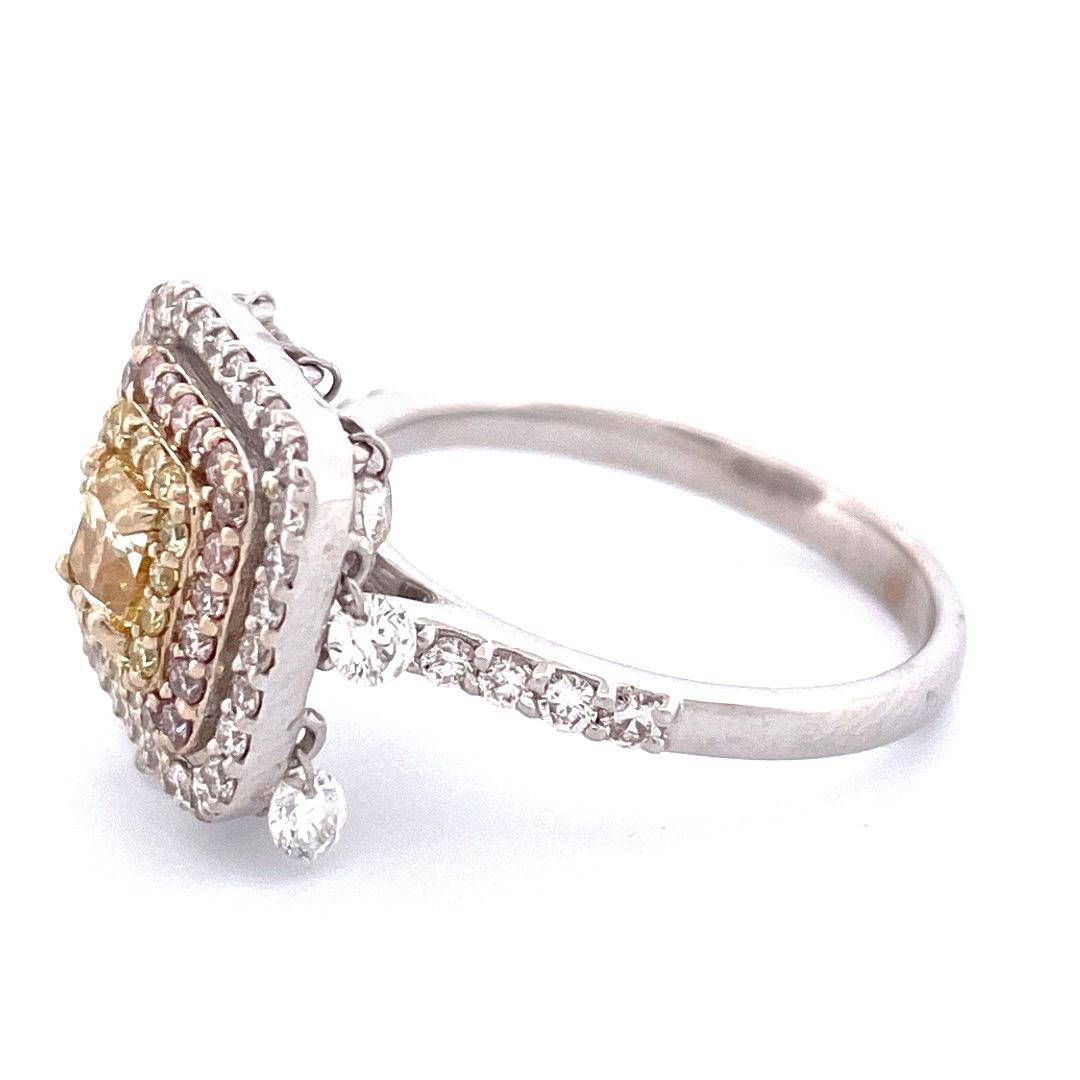 Elevate your style with this exquisite 18k white gold diamond halo ring. The captivating centerpiece features a dazzling square yellow diamond, surrounded by a sparkling diamonds. With a total carat weight of 1.66 and a weight of 4.82 grams, this
