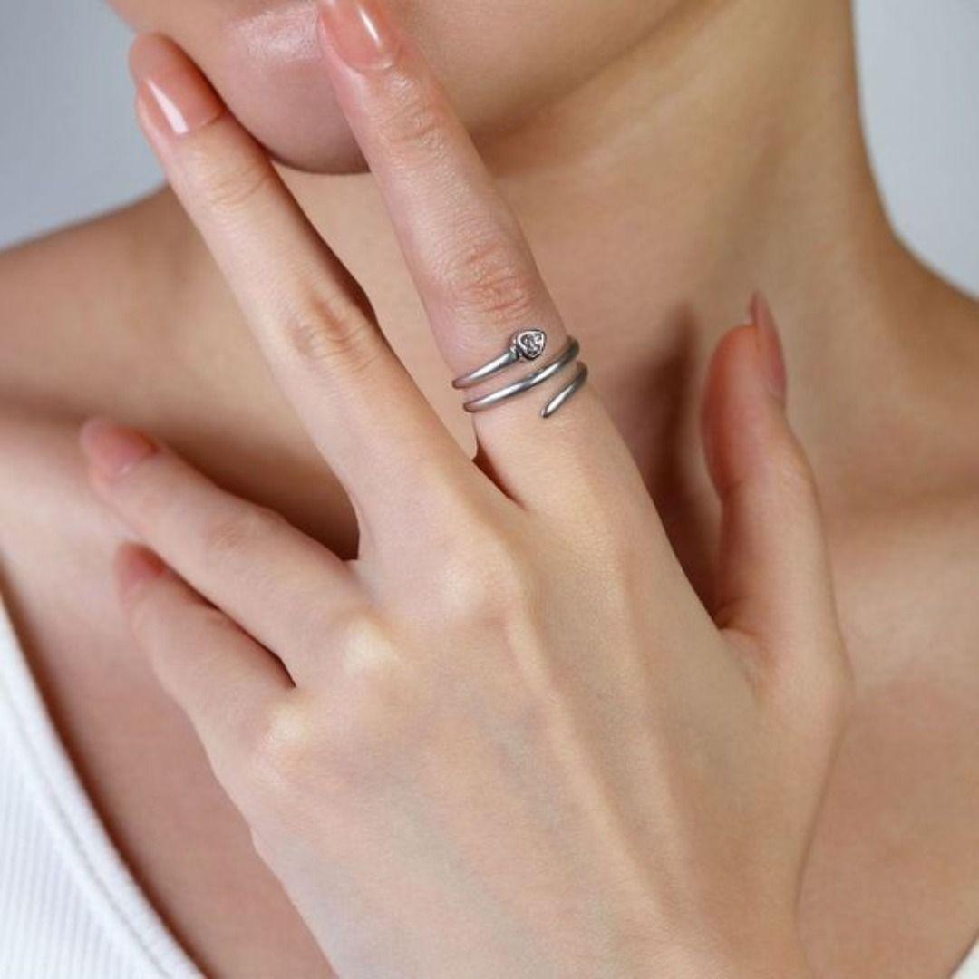 Introducing our elegant 18K White Gold Ring, a testament to timeless sophistication and refined elegance. At the heart of this exquisite piece shines a stunning round brilliant natural diamond, with a delicate carat weight of 0.05ct. The diamond,