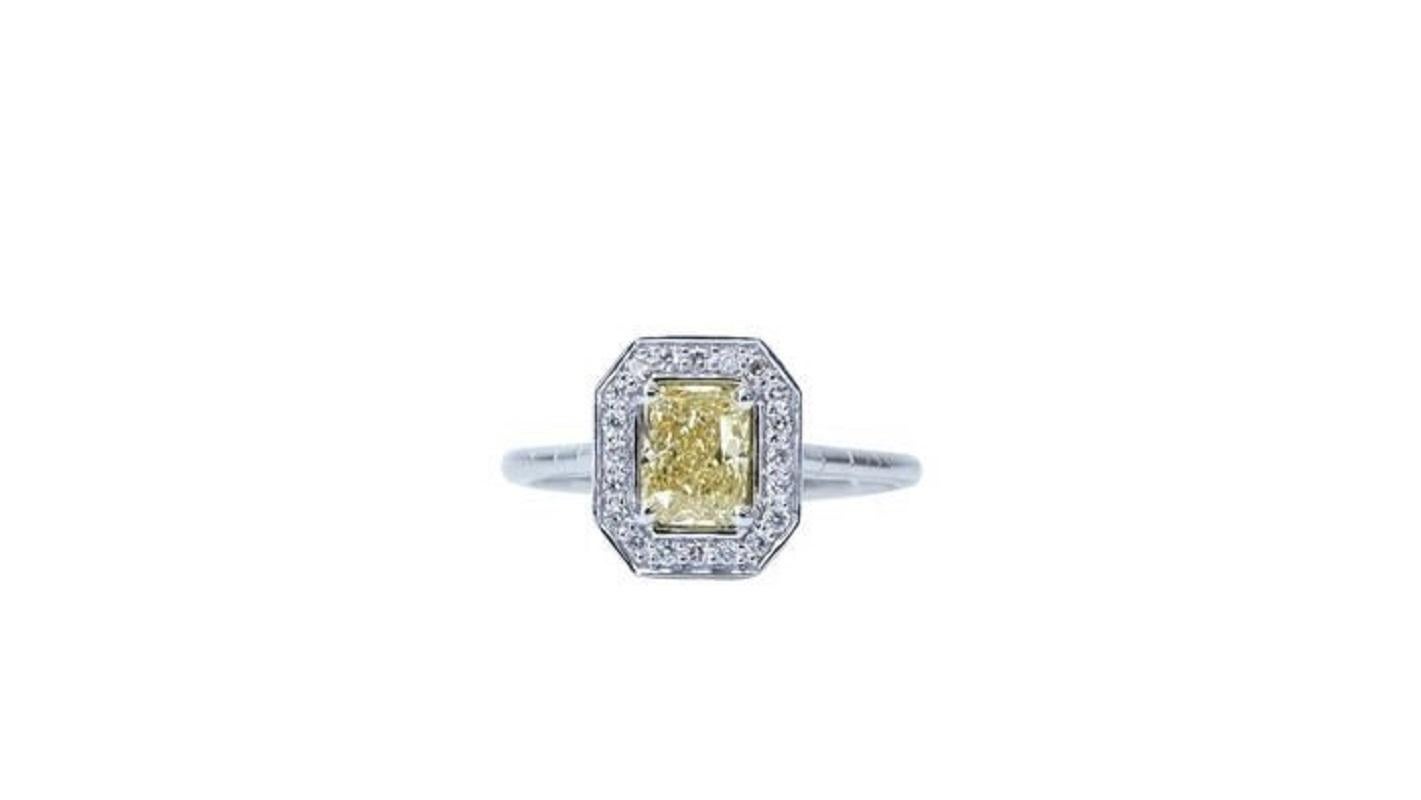 Beautiful 18k white gold diamond ring with natural brownish yellow cushion cut diamond and ideal round brilliant diamonds with a 1.07 total carat weight. This jewelry comes with an GIA certificate and a beautiful box.  

-1 diamond main stone of