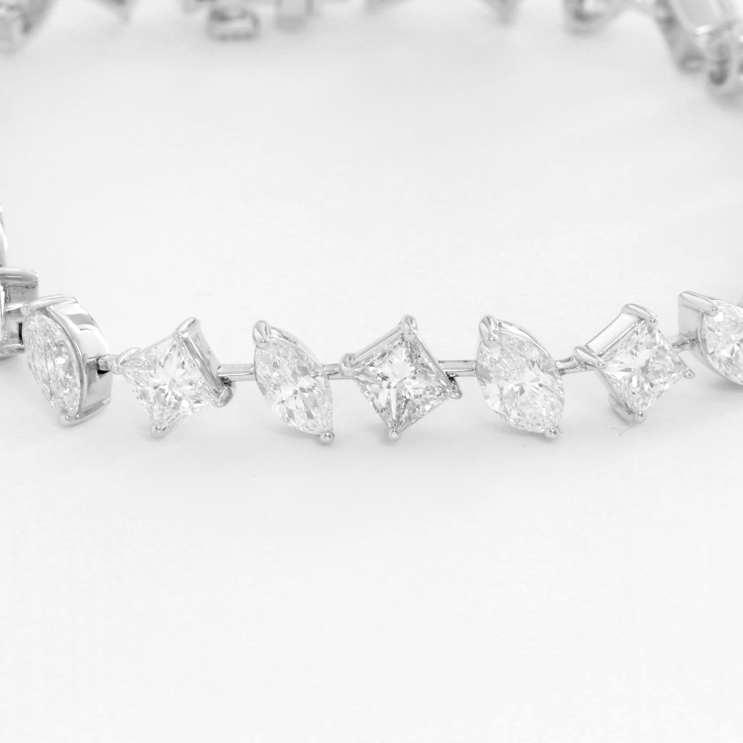 Stunning 18K White gold Tennis Bracelet 13.39 cts. - Crafted in 18K White gold with  28 diamonds weighing 13.39cts.  Alternating from a Princess cut and a Pear shaped diamond. Color G-H - Clarity SI2-SI3. Truly stunning and one of a kind.  7 inches