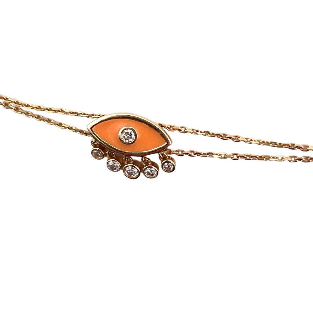 Stunning 18k Yellow Gold Evil Eye Diamond Bracelet

Ward off negativity with our mesmerizing 18k yellow gold evil eye bracelet. The eye is adorned with vibrant orange enamel and a brilliant diamond at its center. Five additional diamonds, totaling