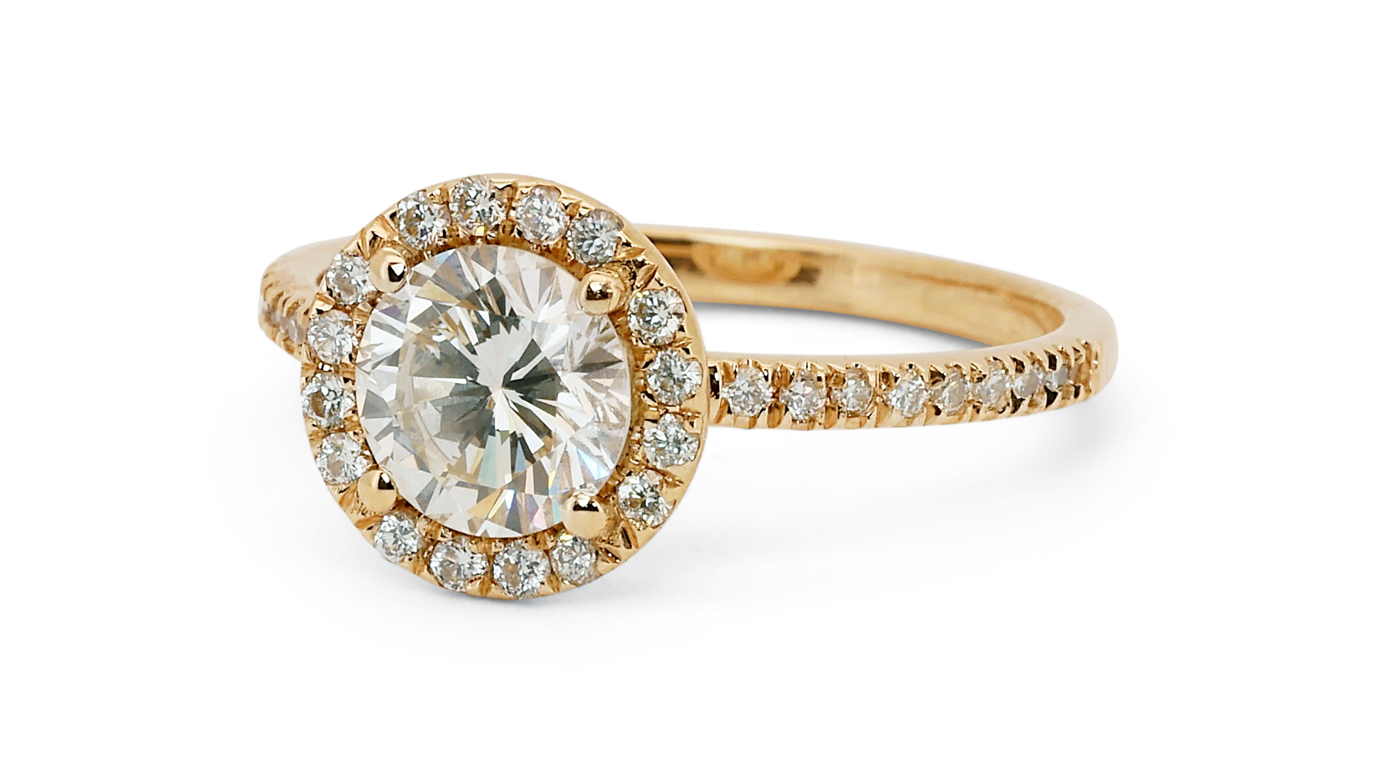 A gorgeous halo cluster ring with a dazzling 1.05 carat round brilliant natural diamond. It has 0.30 carat of side diamonds which add more to its elegance. The jewelry is made of 18K Yellow Gold with a high quality polish. It comes with IGI