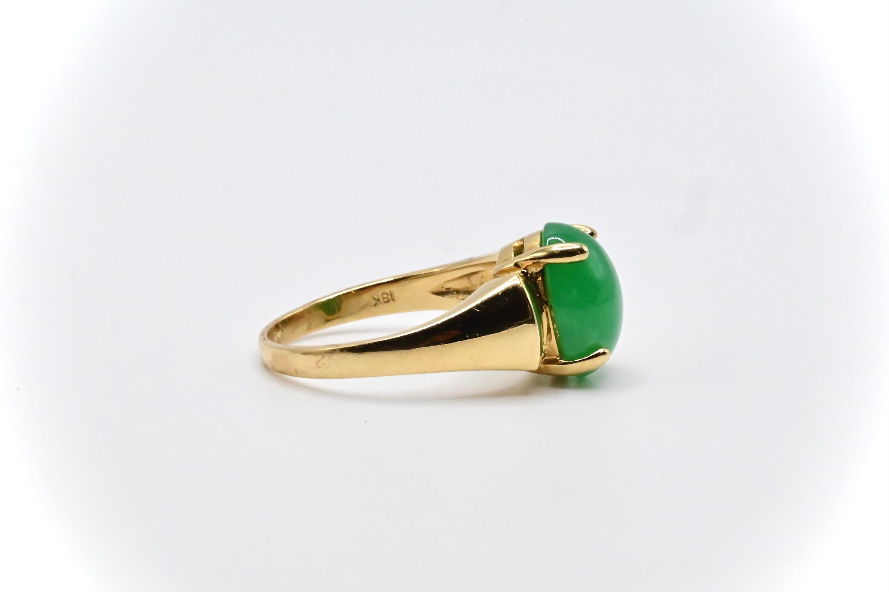 This is a simple, yet elegant 18k yellow gold ring with a beautiful oval jade in the middle with round diamond accents. It’s a size 6, and weighs approximately 4 grams. It’s in good condition with little wear, and if you have any questions or