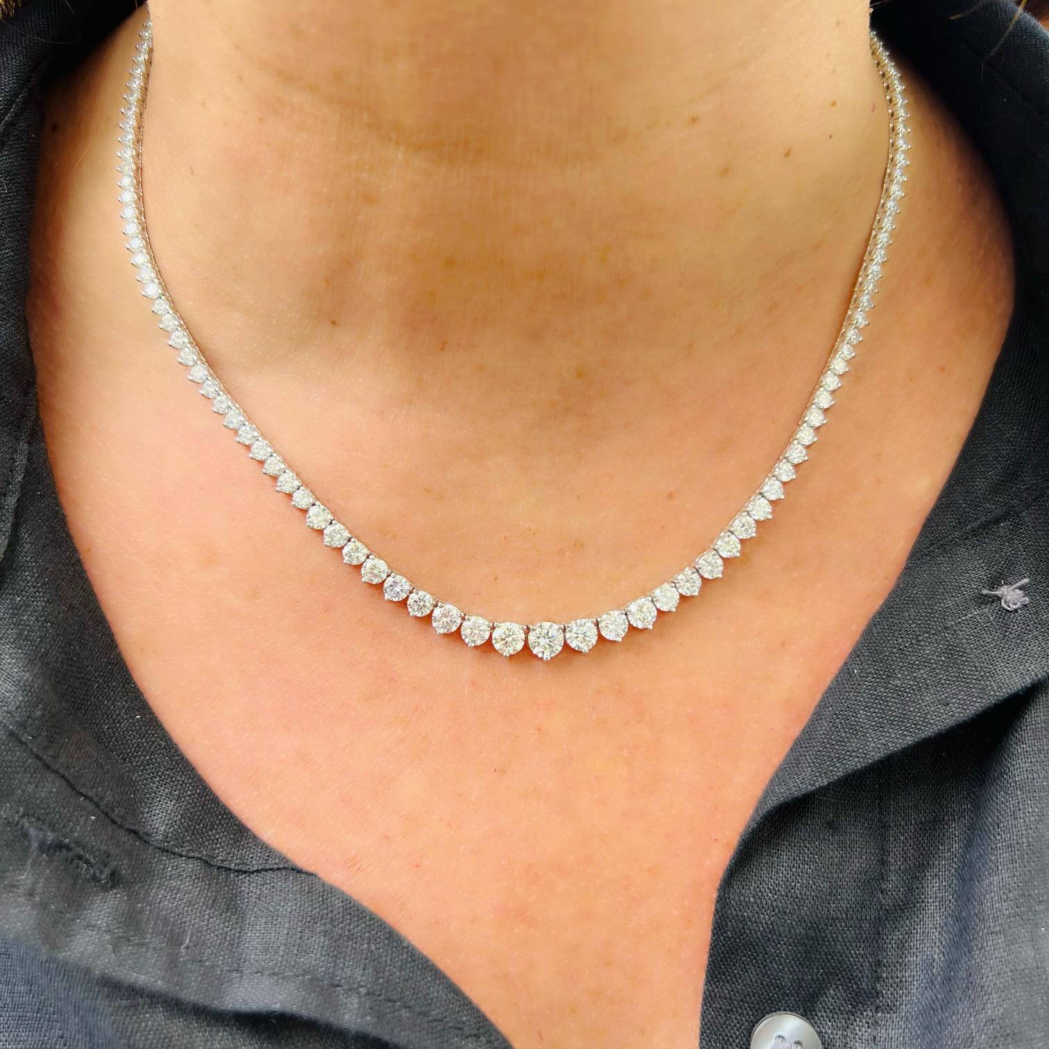 A versatile piece that is sure to turn heads, this 18 karat white gold diamond line necklace is an absolute beauty. Featuring 145 fine natural diamonds for 14.82 carats total weight, the diamonds in this piece match exceptionally well and delivery
