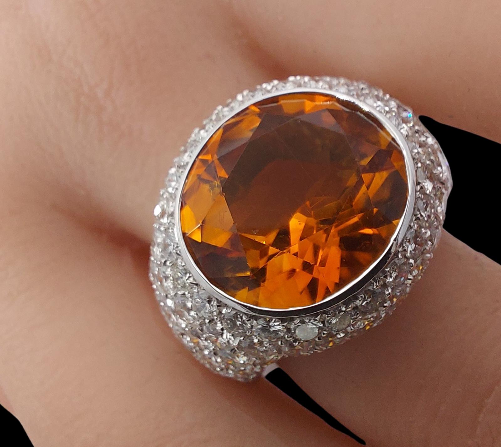 Stunning 18kt white gold ring set with diamonds and citrine stone.

Citrine: Citrine stone of approx 13.5 x 15 mm

Diamonds: White diamonds, together approx. 6.4ct diamonds

Material: Solid 18kt white gold

Total weight: 24.8 gram / 0.875 oz / 15.9