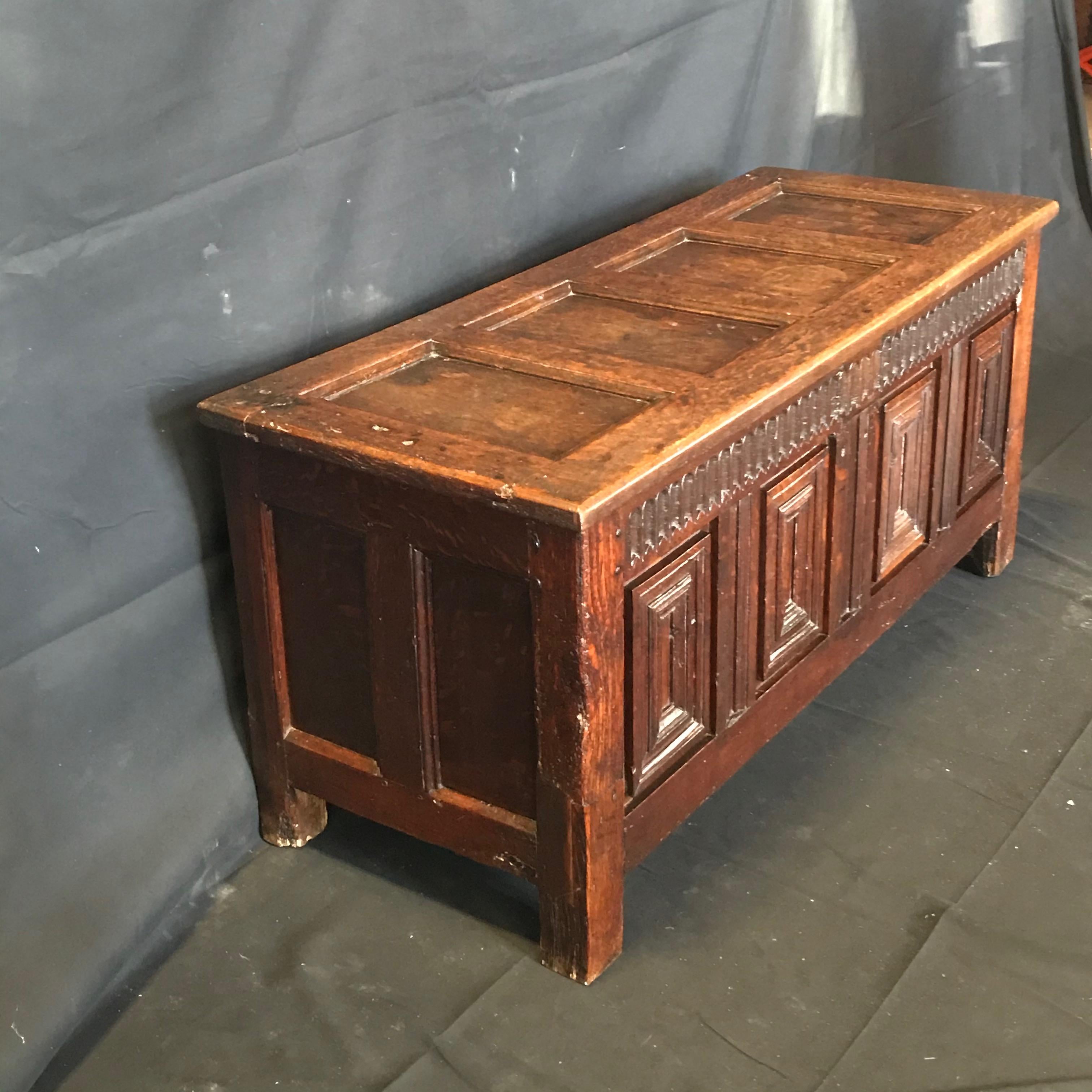 Gorgeous rare early 18th century highly carved and paneled French coffer, with four panels to the front, two panels to each side, raised on stile feet, unusual fitted inside, original hammered hinges, beautiful color and patina!
#3474
Measures: H