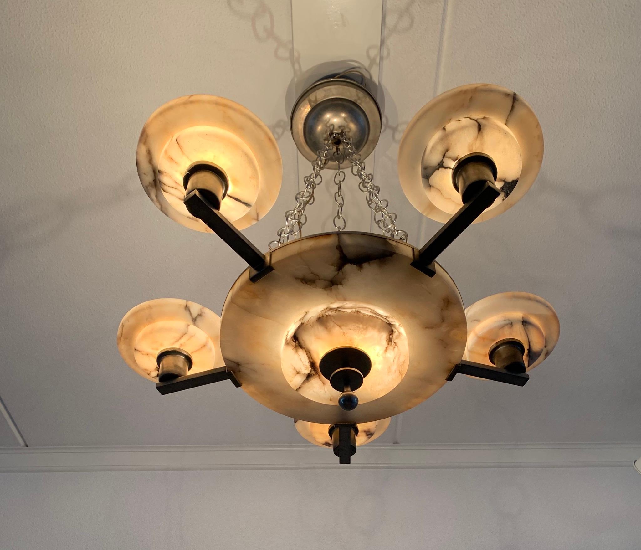 Top quality chandelier with nickel plated brass arms and striking alabaster shades.
 
If you are looking for a truly stylish light fixture that also creates enough light above your dining table or in the center of your entry hall then this
