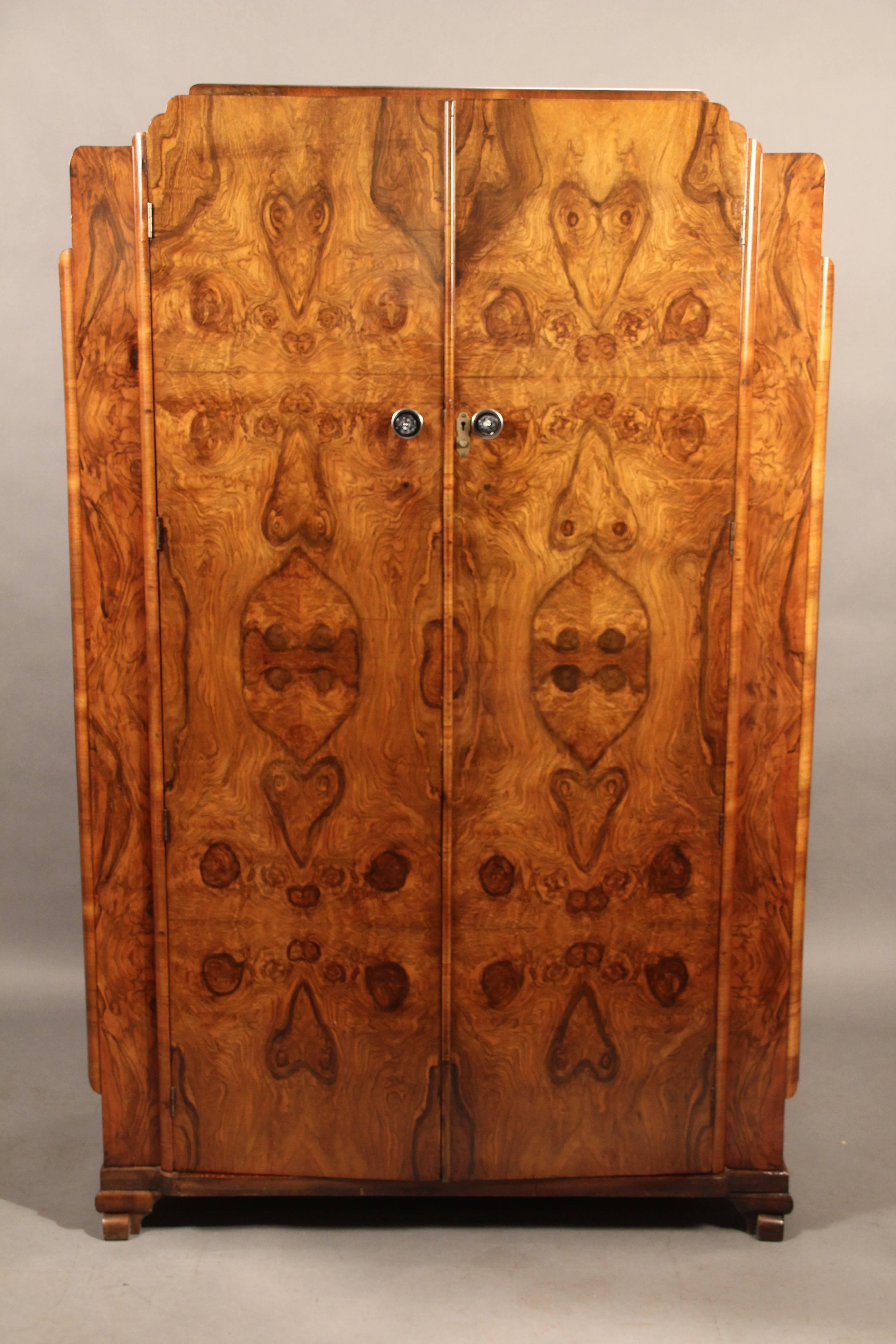 Armoire with beautiful burl wood front. Back was drilled for electronics at one point, circa 1930s.